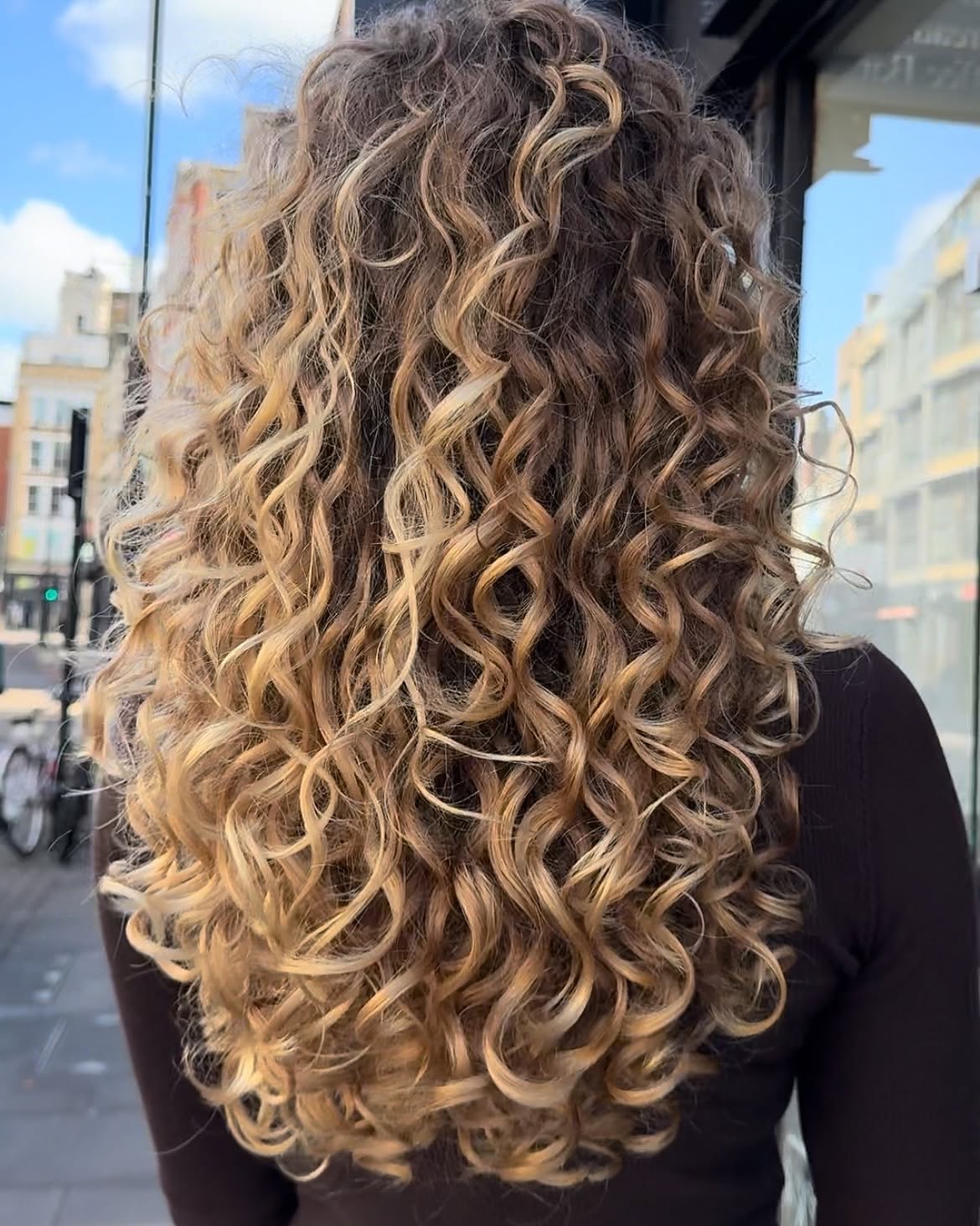 Dimensional Honey Blonde Balayage For Long Curly Hair
