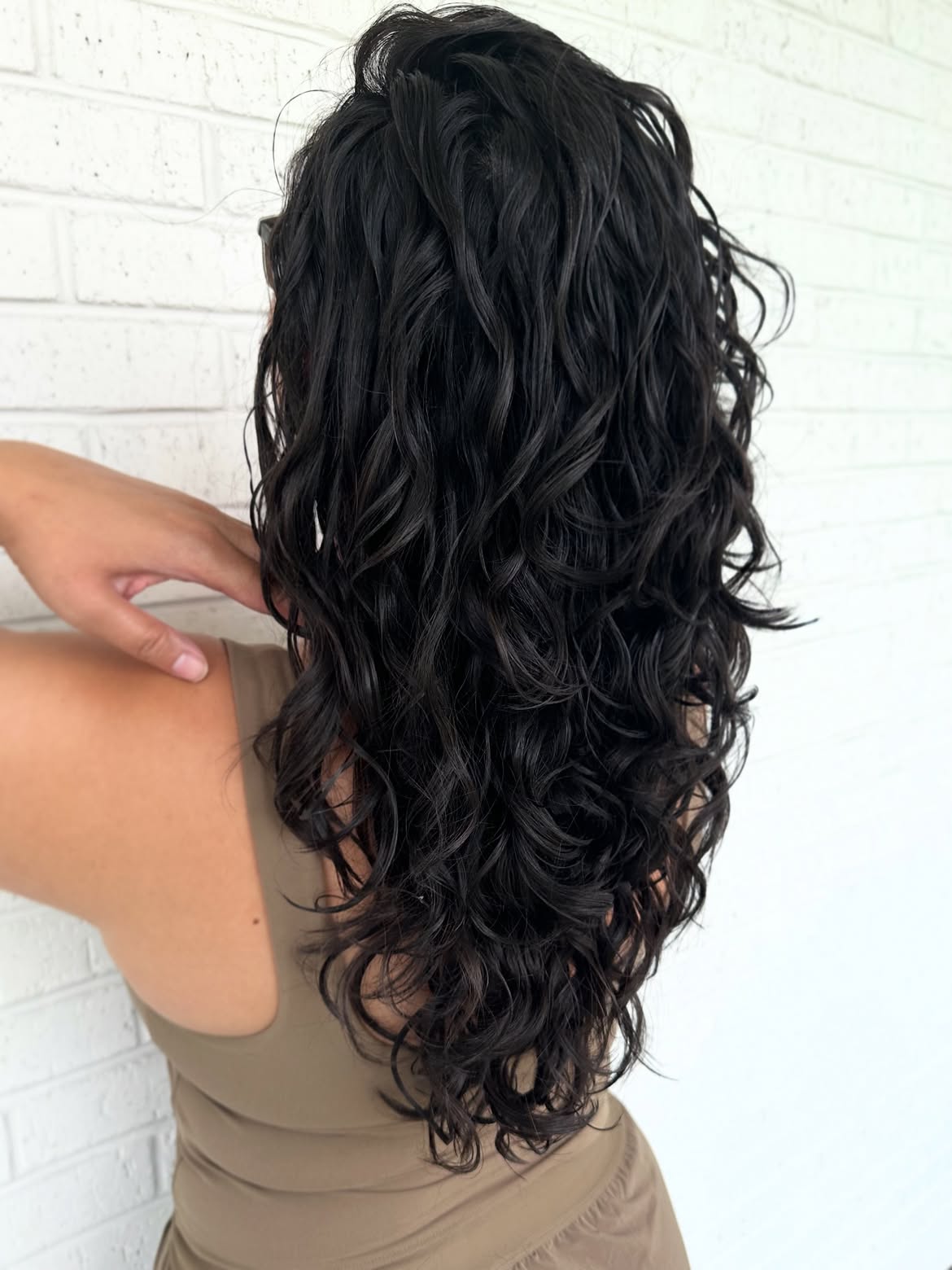 Dimensional Layers On Jet Black Wavy Hair
