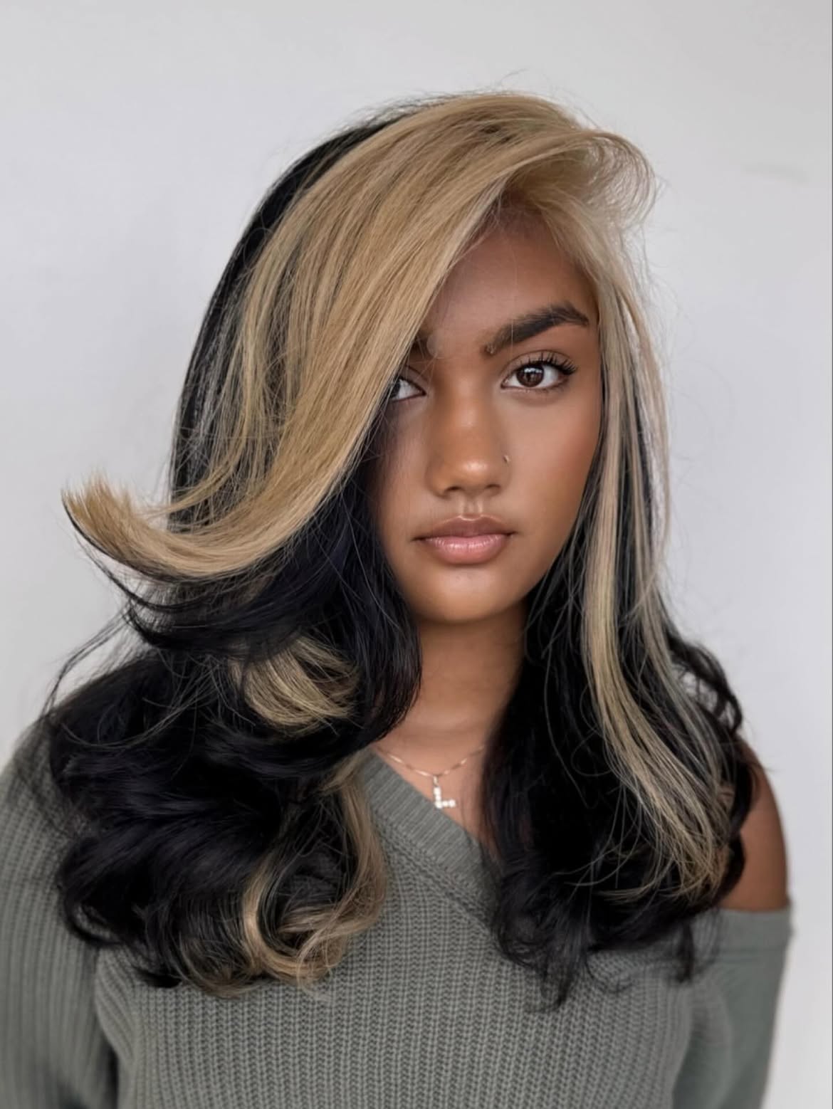 Dramatic Black and Blonde Two-Tone Hair with Face-Framing Layers