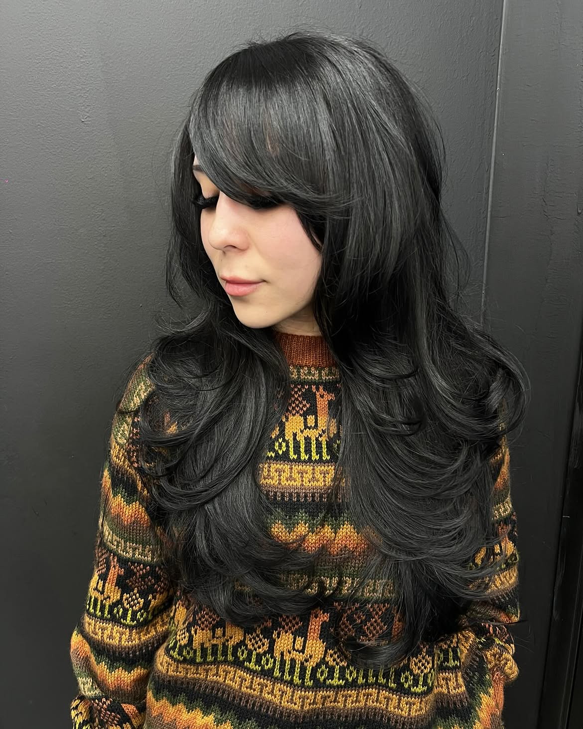 Dramatic Side Swept Bangs With Voluminous Curls