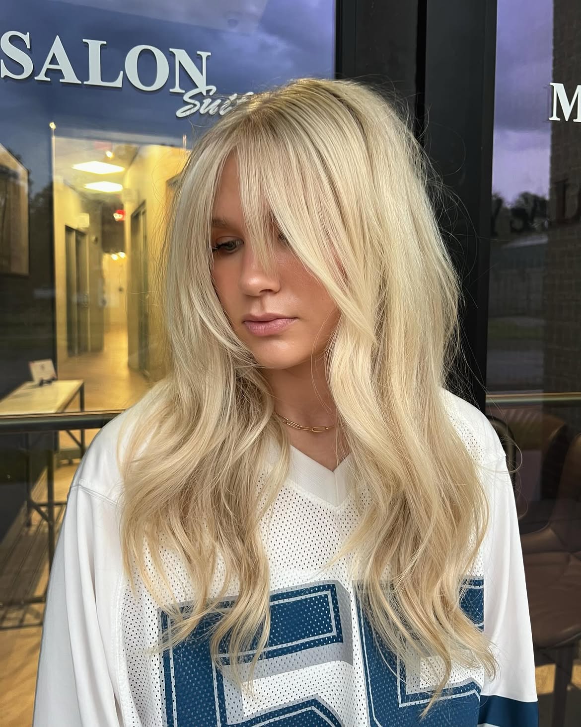 Effortless Blonde Waves With Wispy Face-Framing Bangs