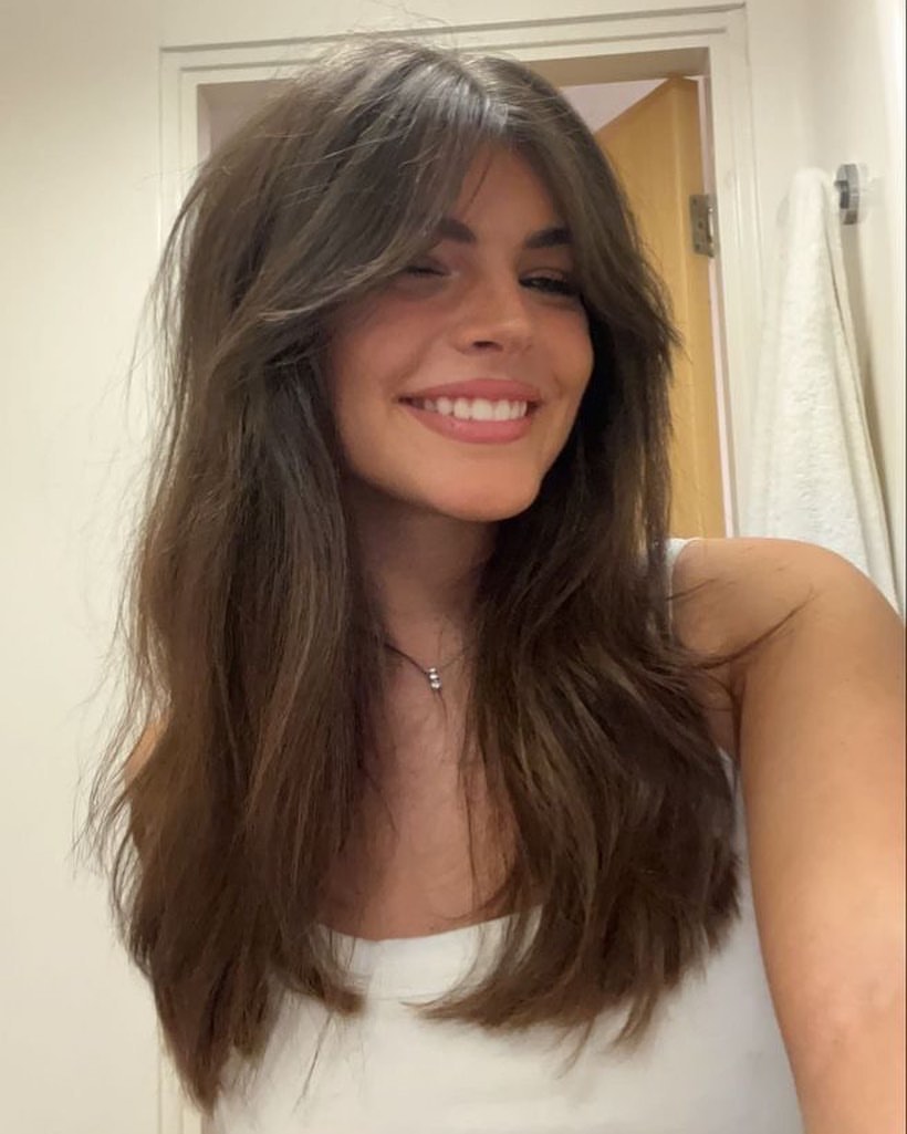 Effortless Brown Curtain Bangs With Soft Waves