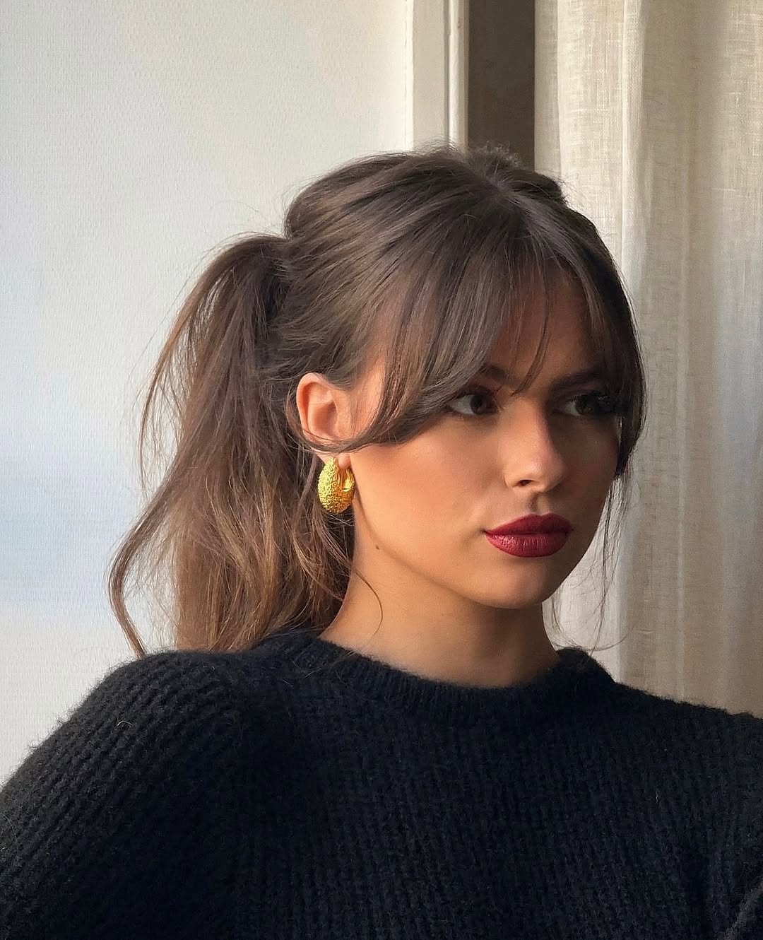 Effortless High Ponytail With Wispy Curtain Bangs