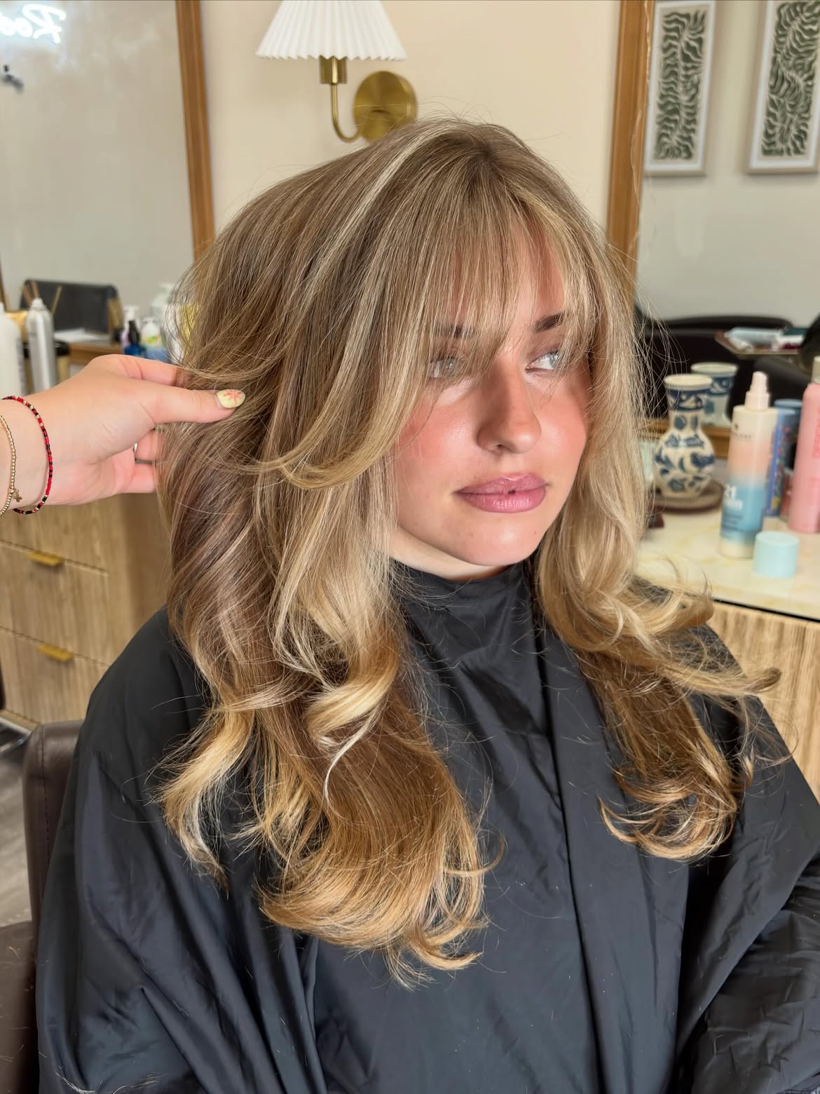 Effortless Honey Blonde Layers With Wispy Bangs
