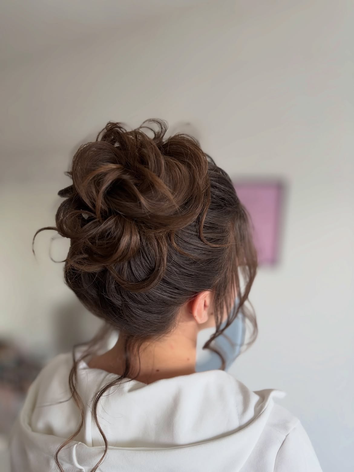 Effortless Messy Updo With Wispy Face-Framing Tendrils
