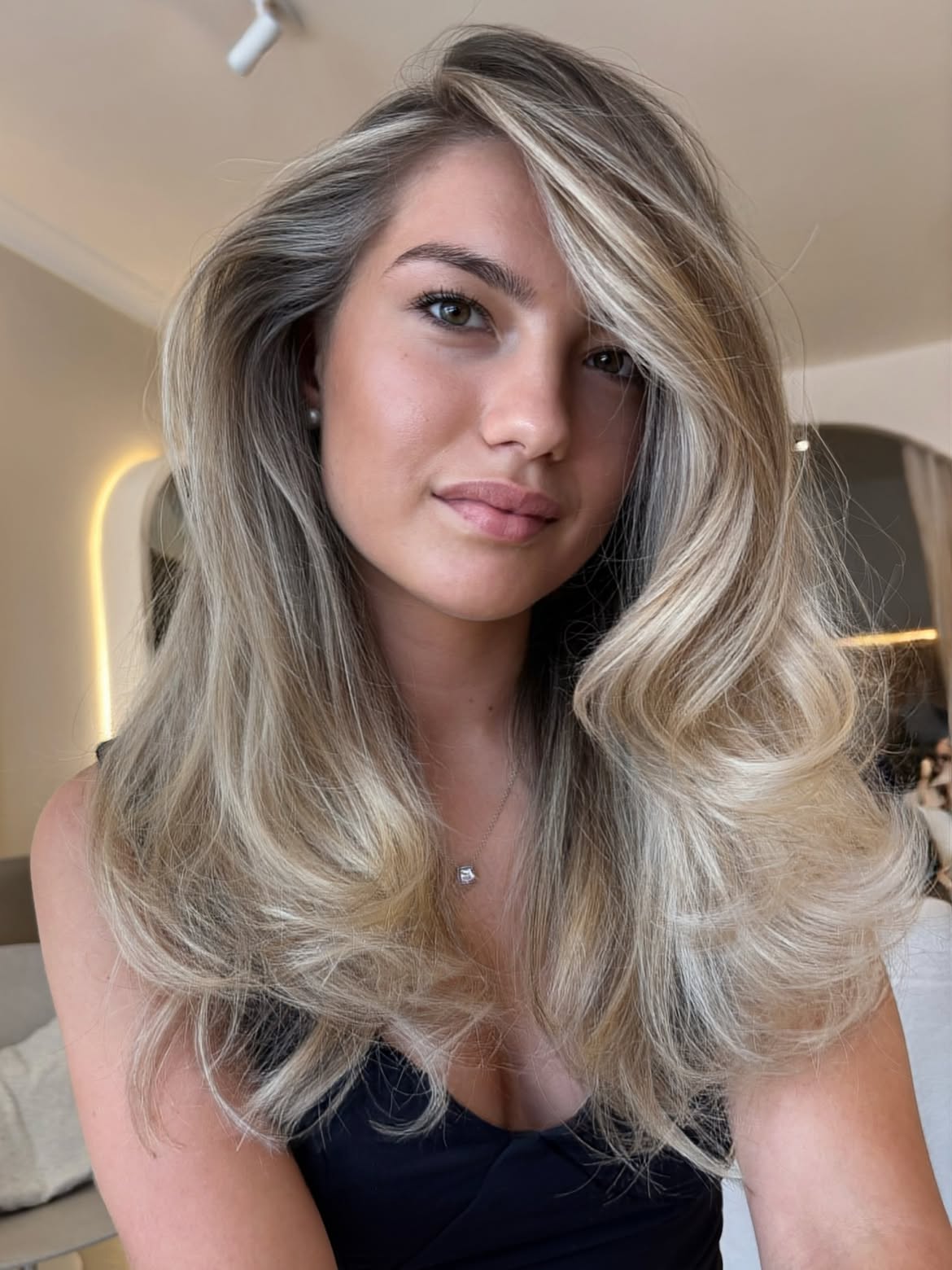 Effortless Voluminous Blonde Waves With Deep Side Part