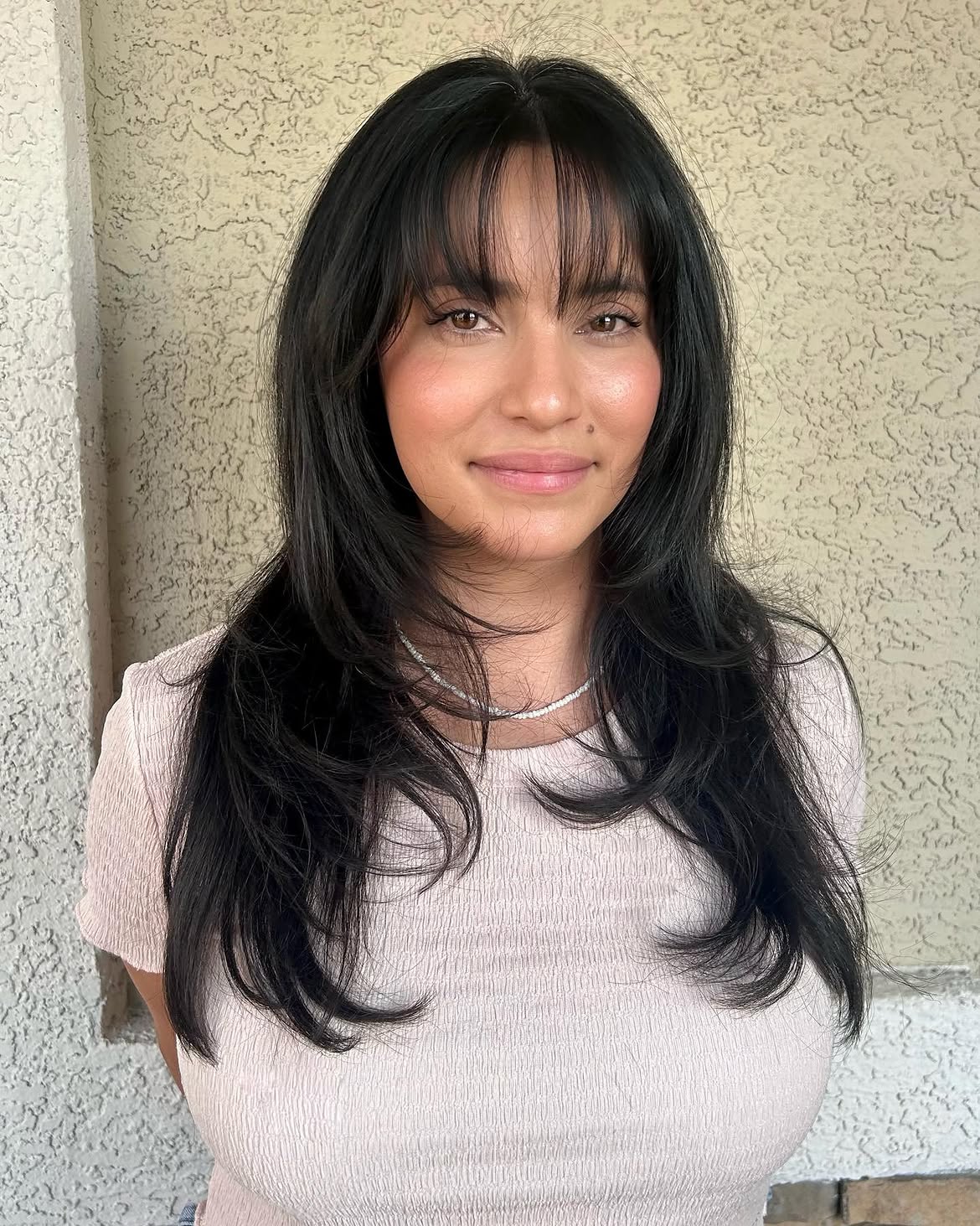 Effortless Wispy Bangs With Face-Framing Layers