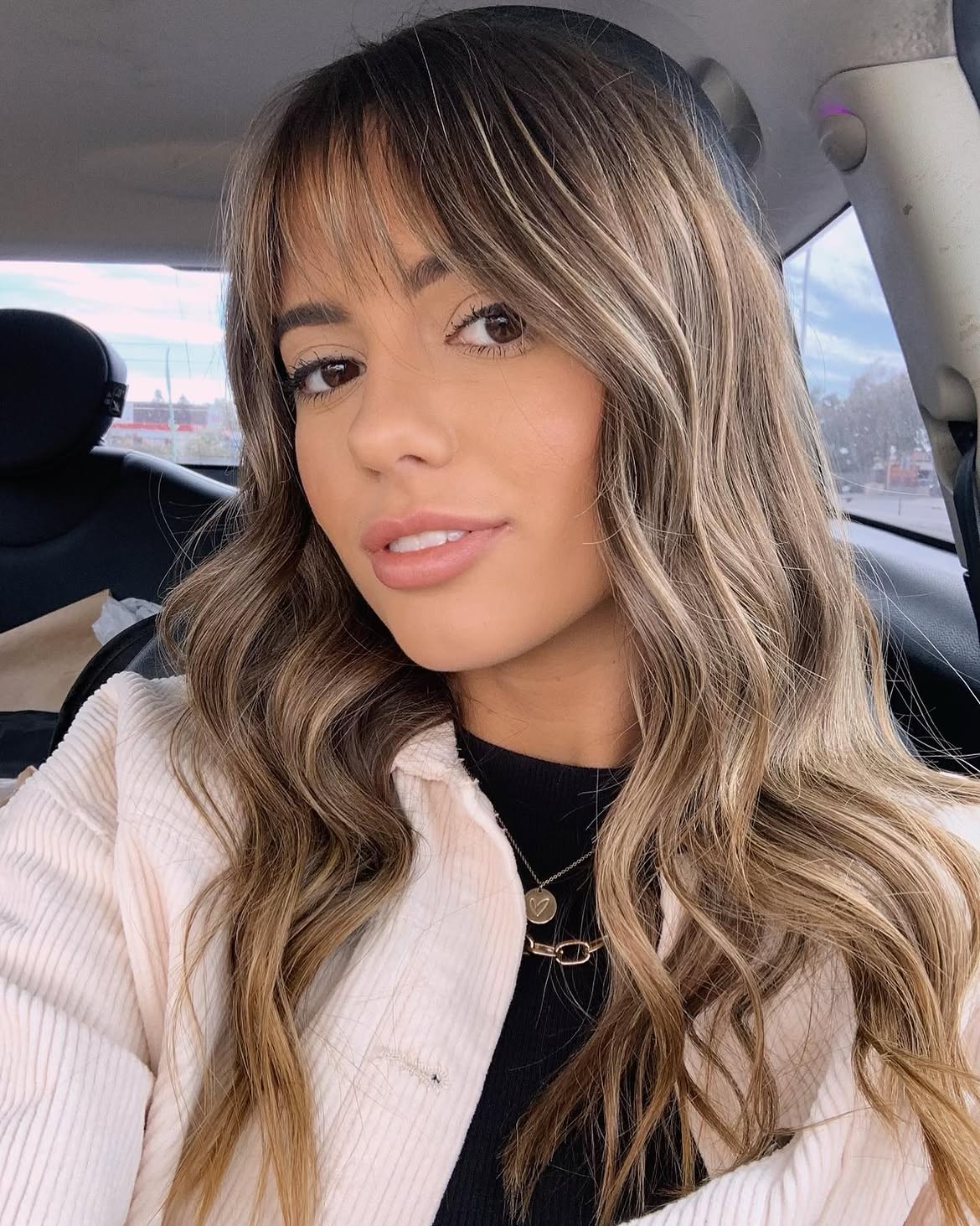 Effortless Wispy Bangs With Honey Blonde Waves