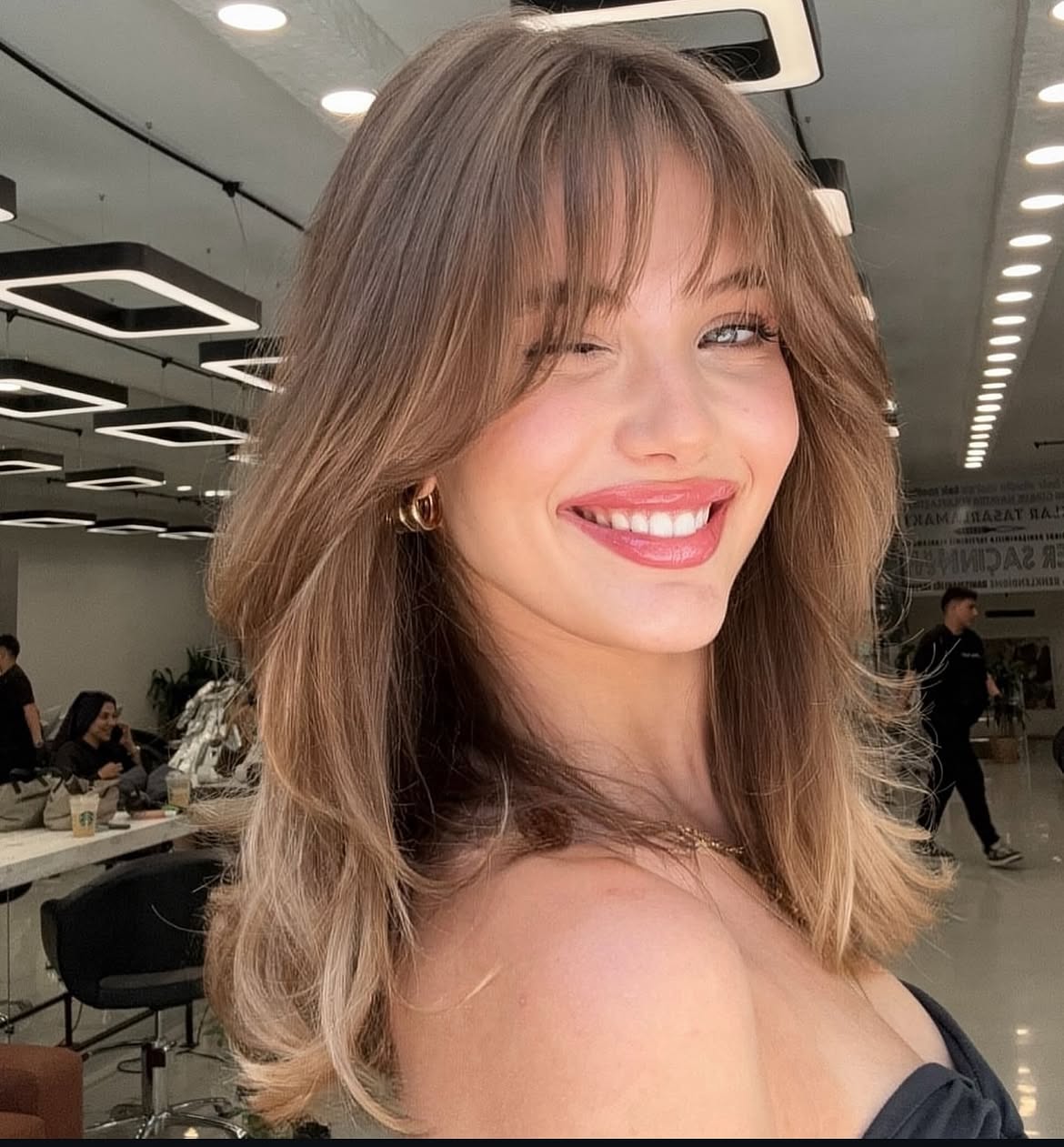 Effortless Wispy Bangs With Voluminous Layers