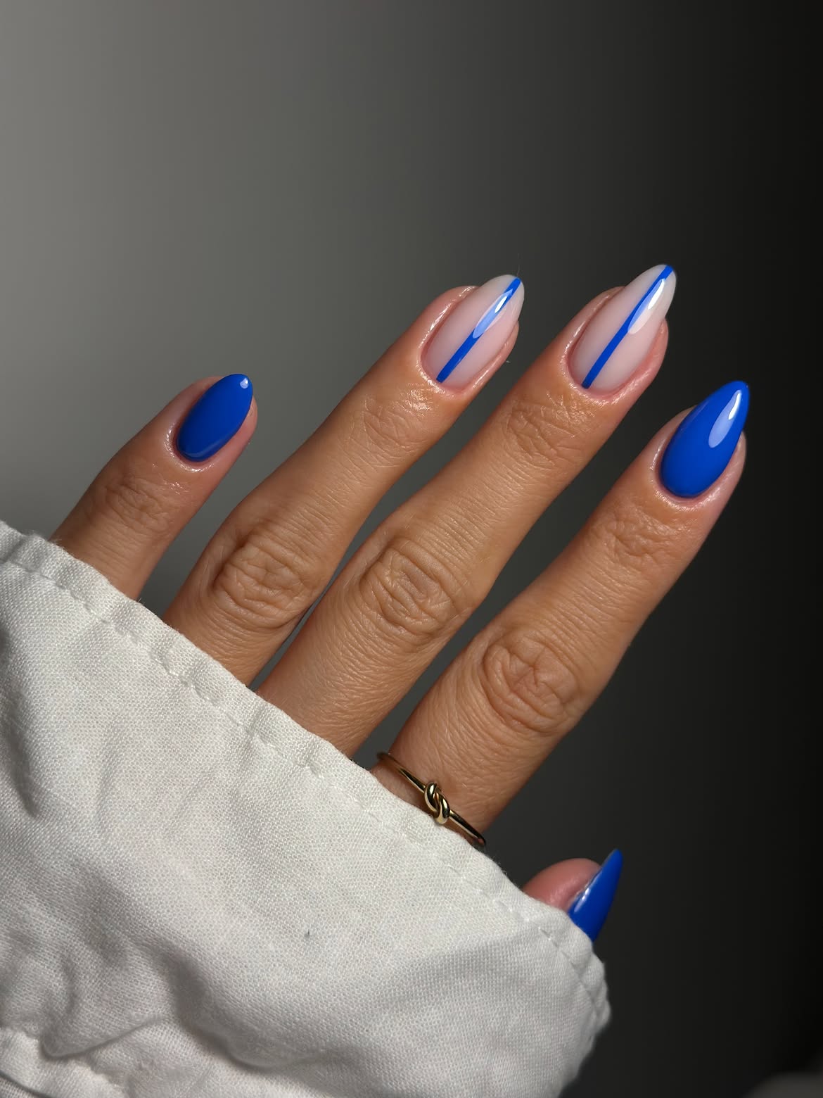 Electric Blue Lines On Nude Almond Nails