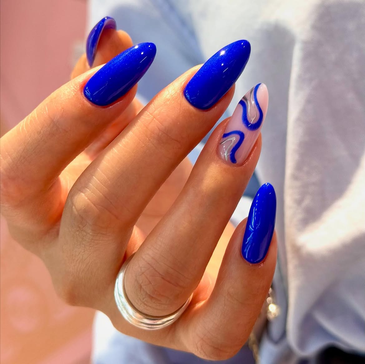 Electric Blue Swirl Almond Nails