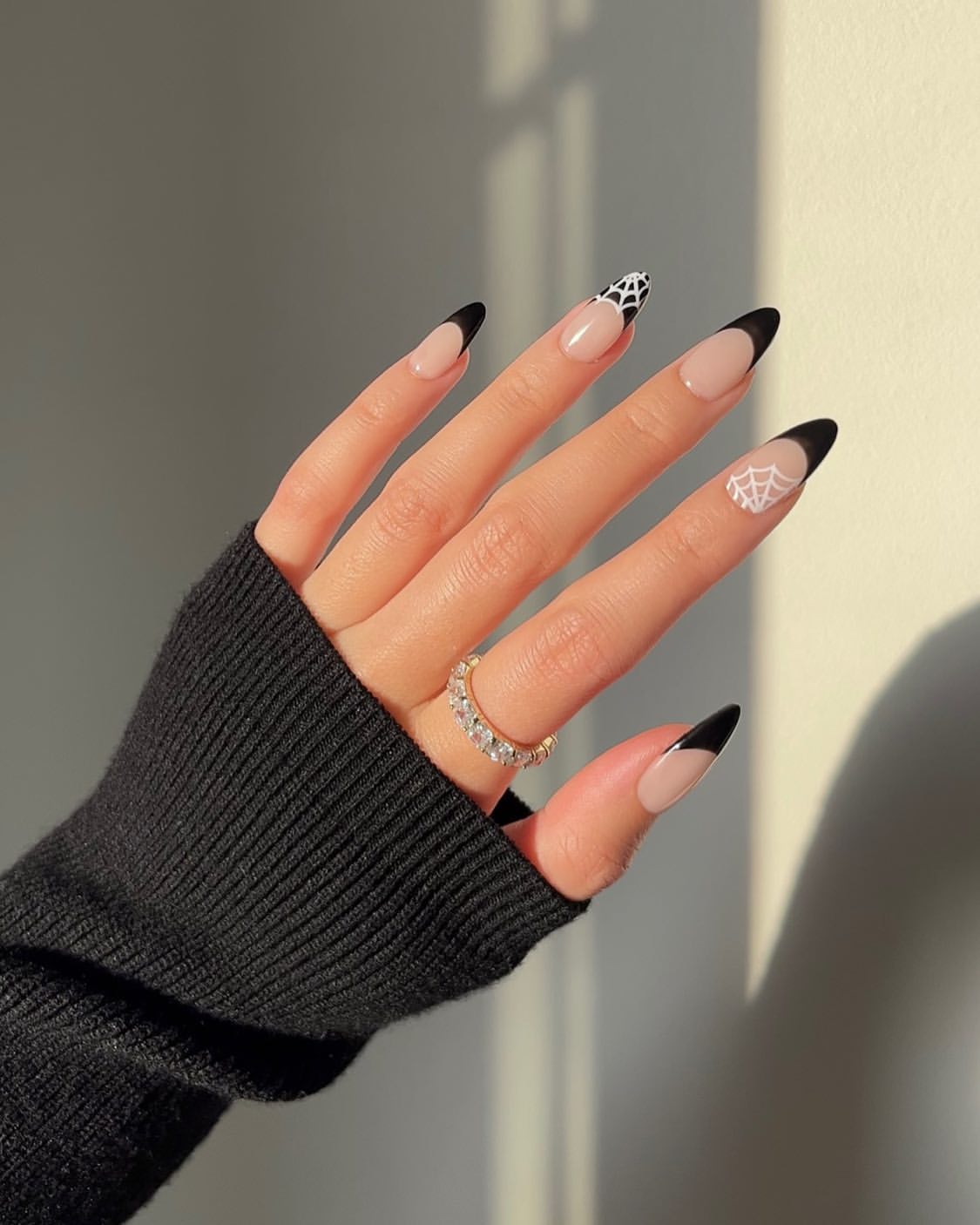 Elegant Black French Tip Spiderweb Almond Nails