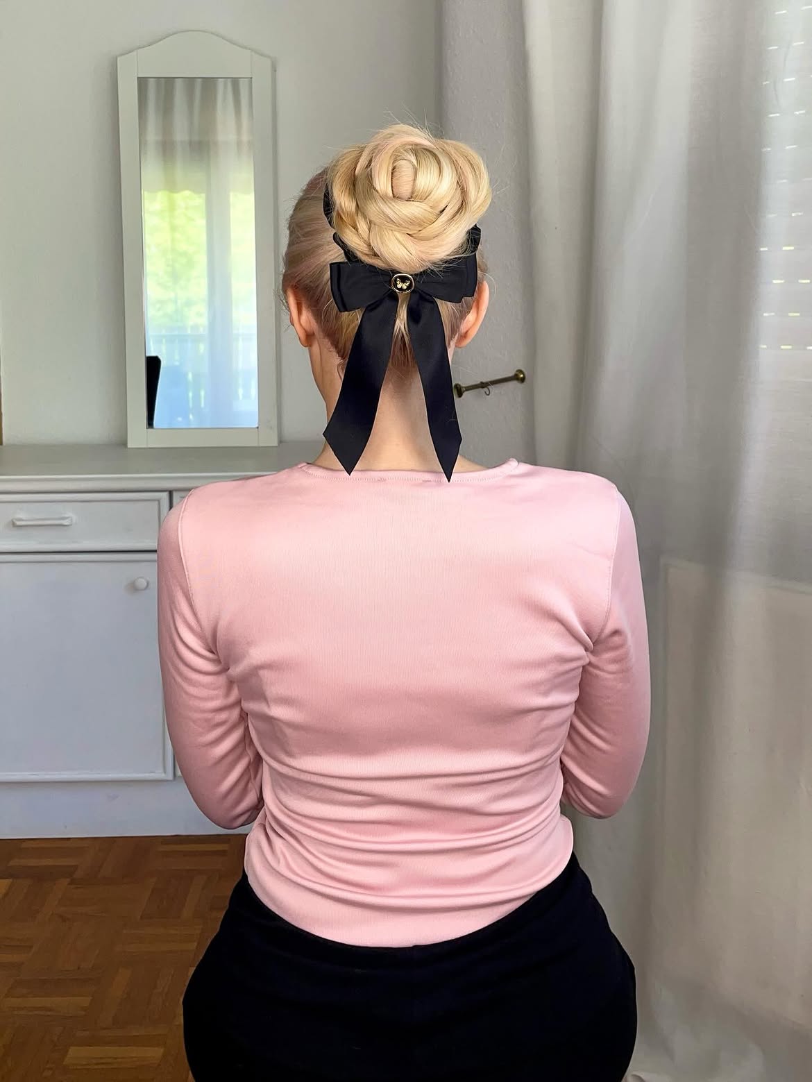Elegant Braided Bun With Black Ribbon Bow