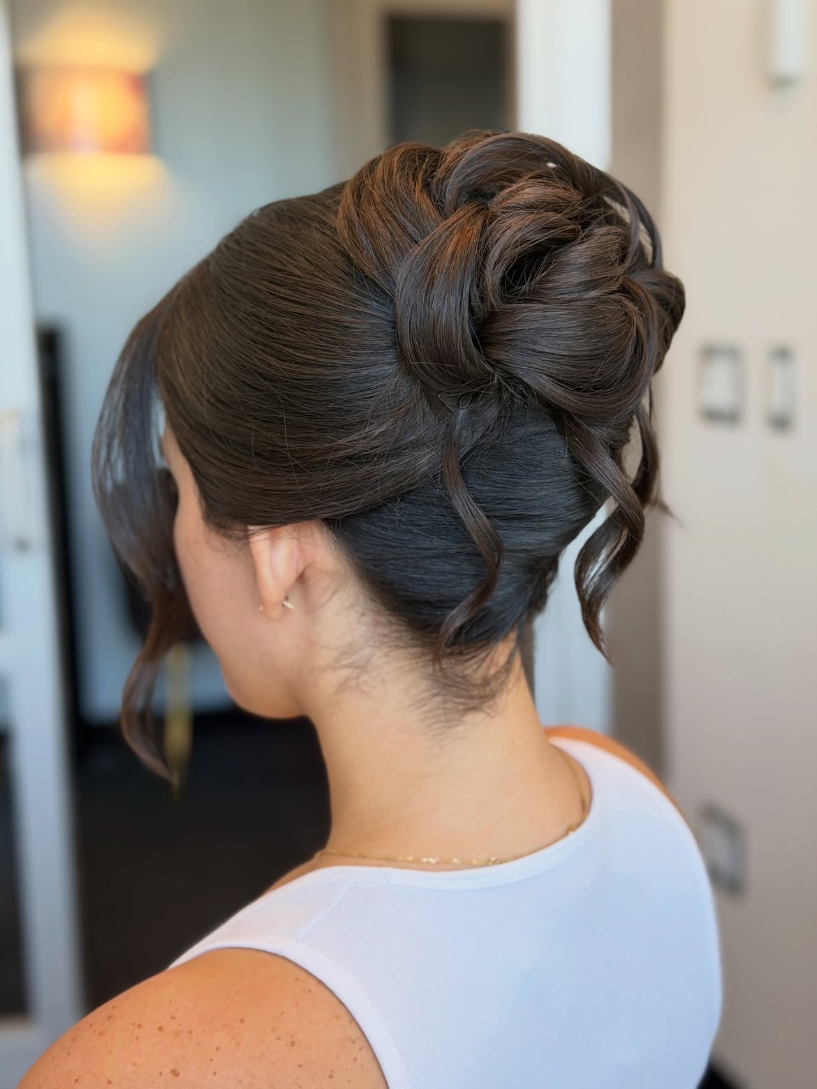 Elegant Chignon With Soft Tendrils