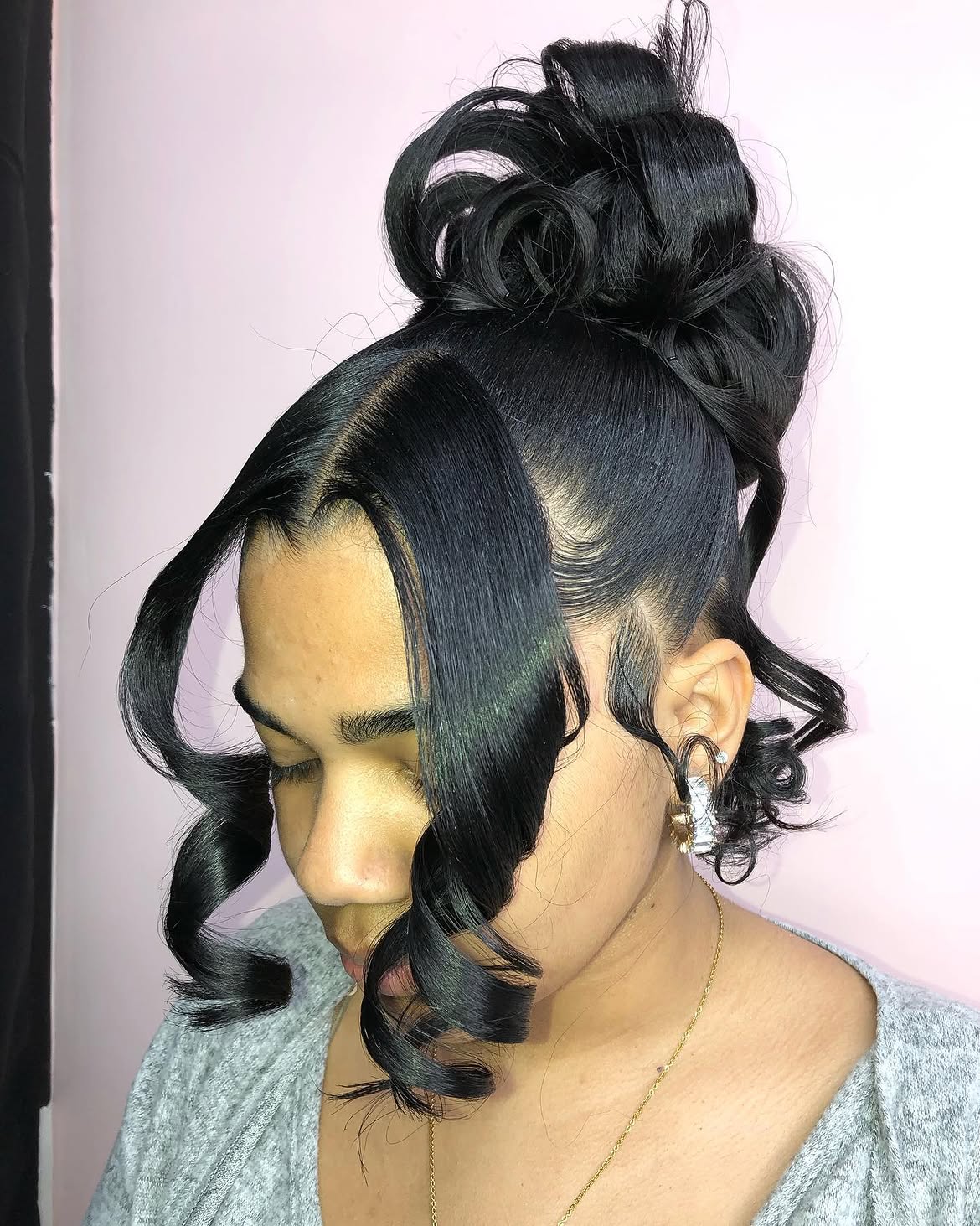 Elegant High Bun With Dramatic Side Curls