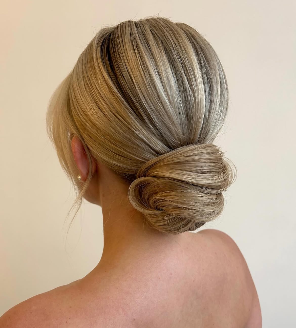 Elegant Low Twisted Chignon With Face-Framing Pieces
