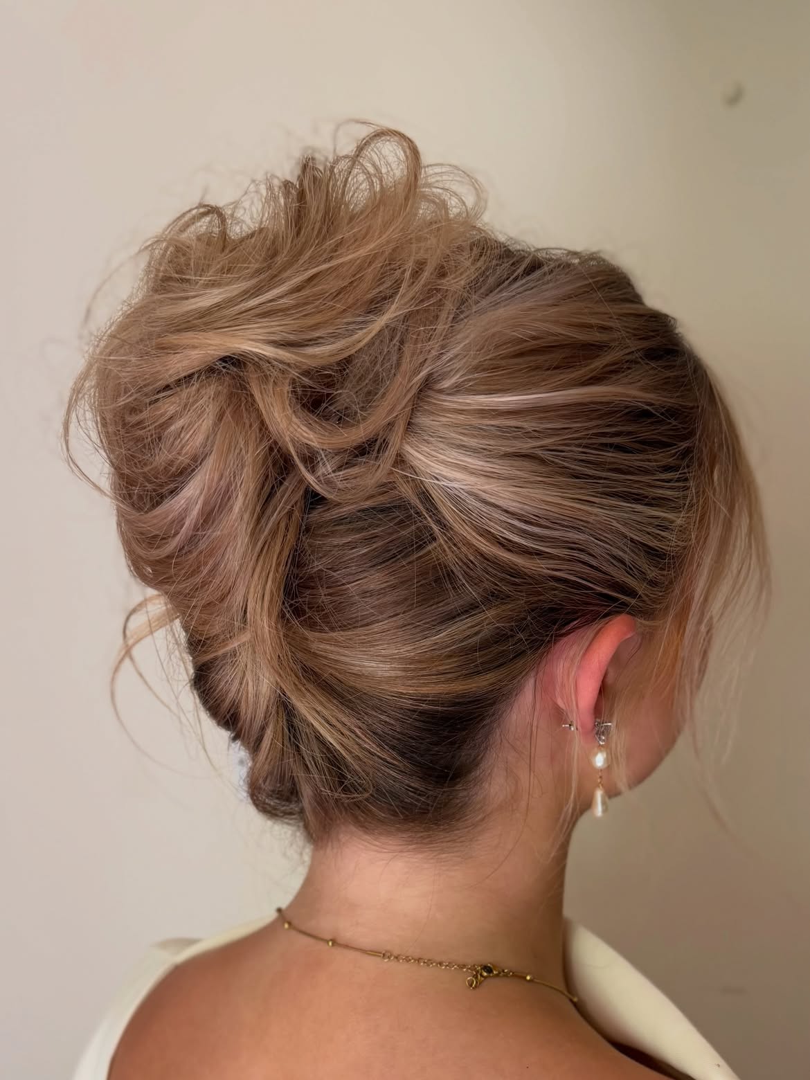 Elegant Messy Updo With Loose Face-Framing Tendrils
