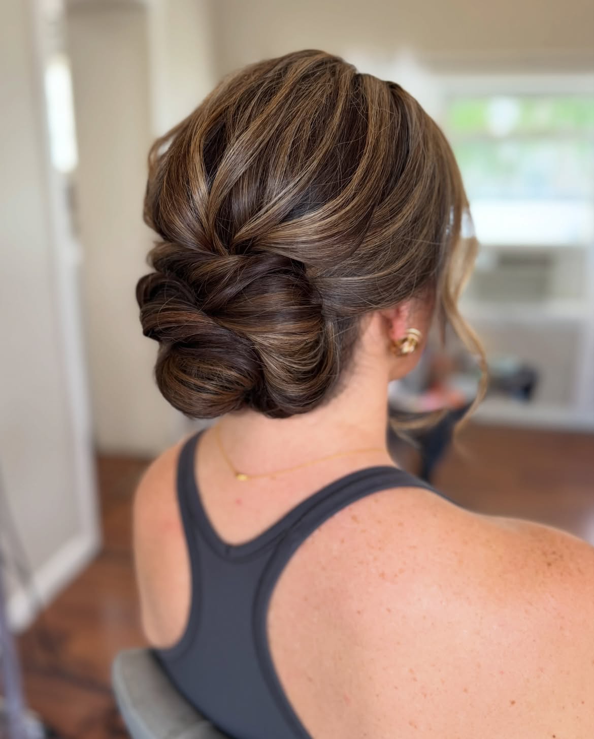 Elegant Twisted Low Updo With Caramel Highlights
