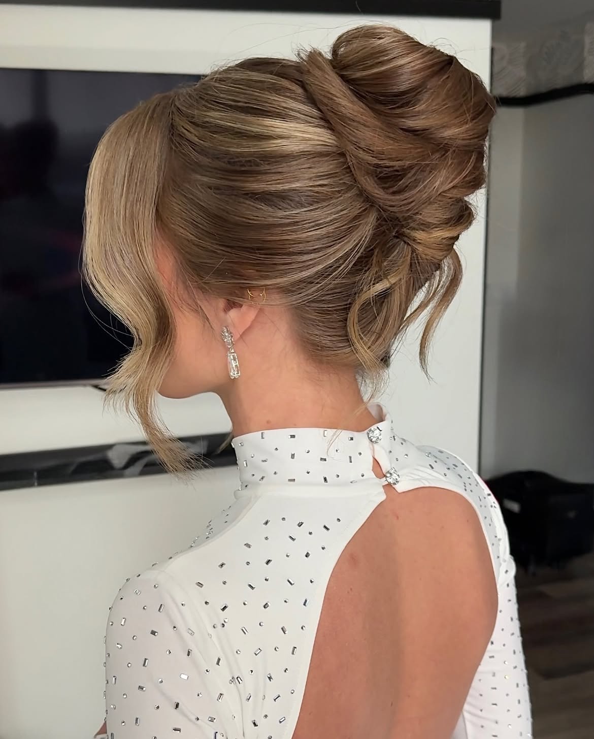 Elegant Twisted Updo With Face-Framing Tendrils