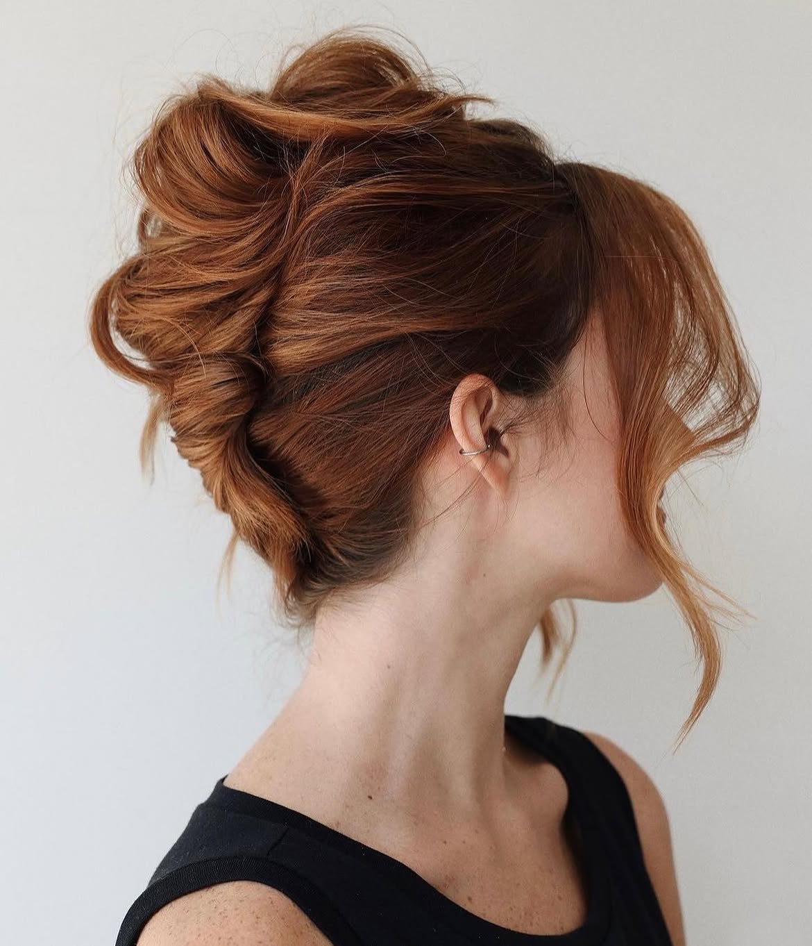Elegant Twisted Updo With Face-Framing Tendrils