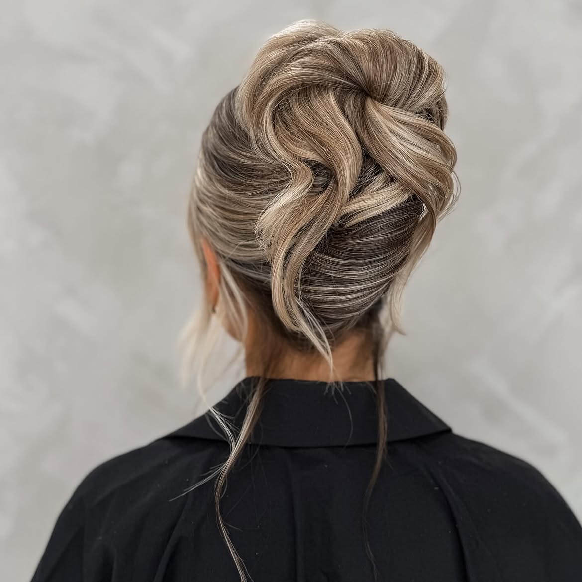 Elegant Twisted Updo With Face-Framing Tendrils