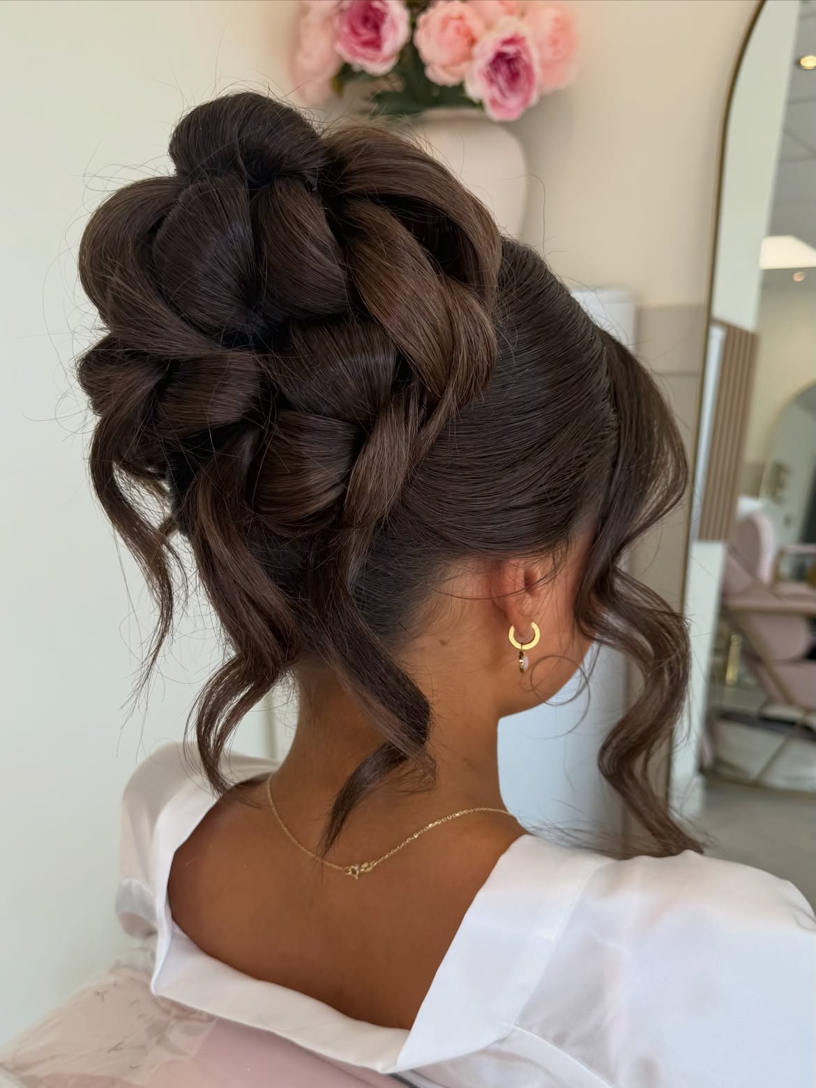 Elegant Twisted Updo With Loose tendrils