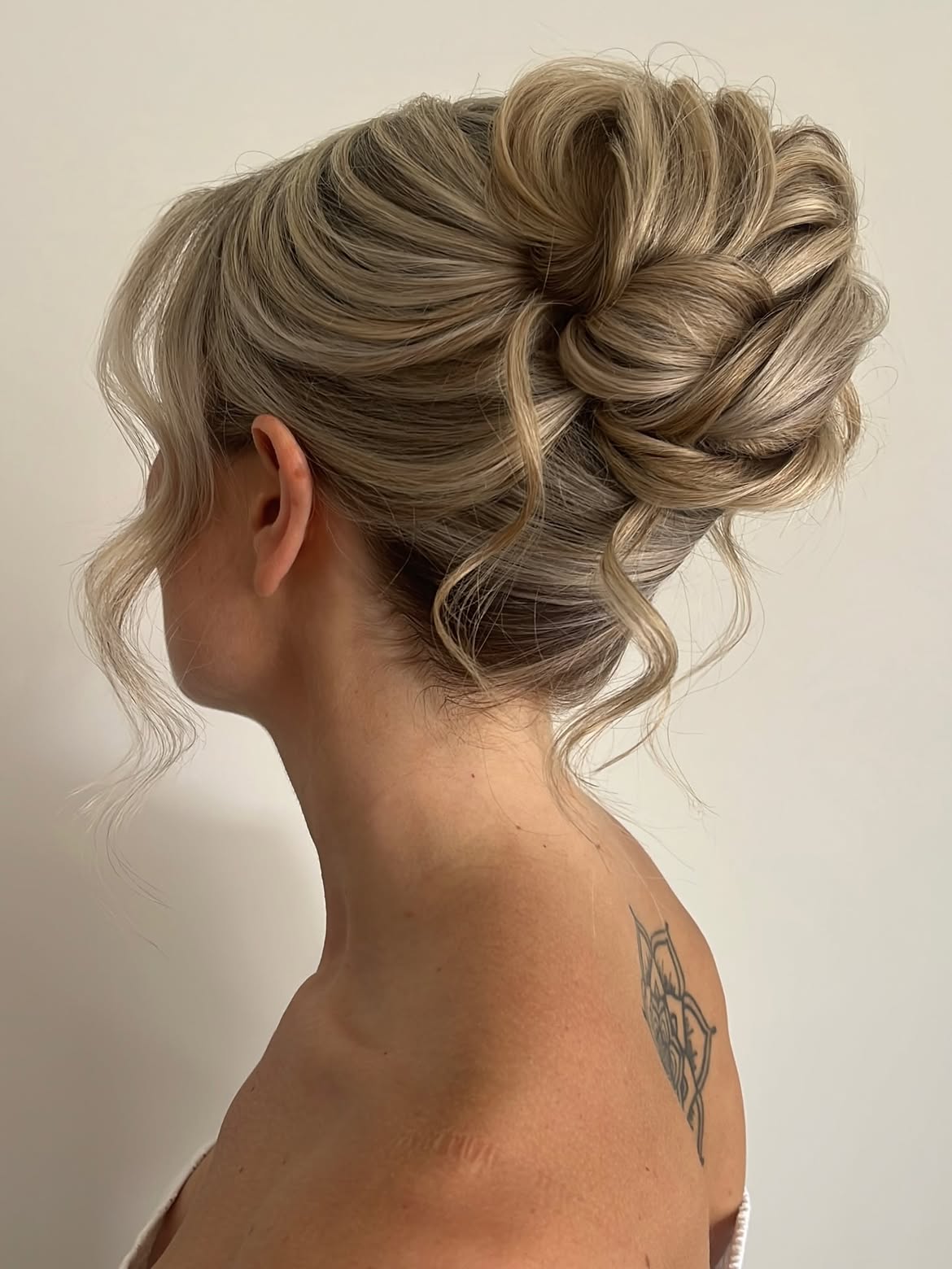 Elegant Twisted Updo With Loose Tendrils