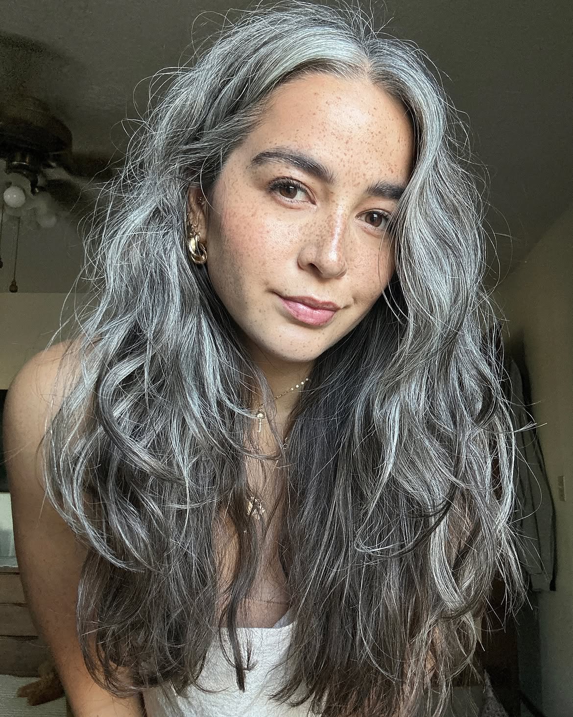 Embracing Natural Grey Waves With Face-Framing Layers