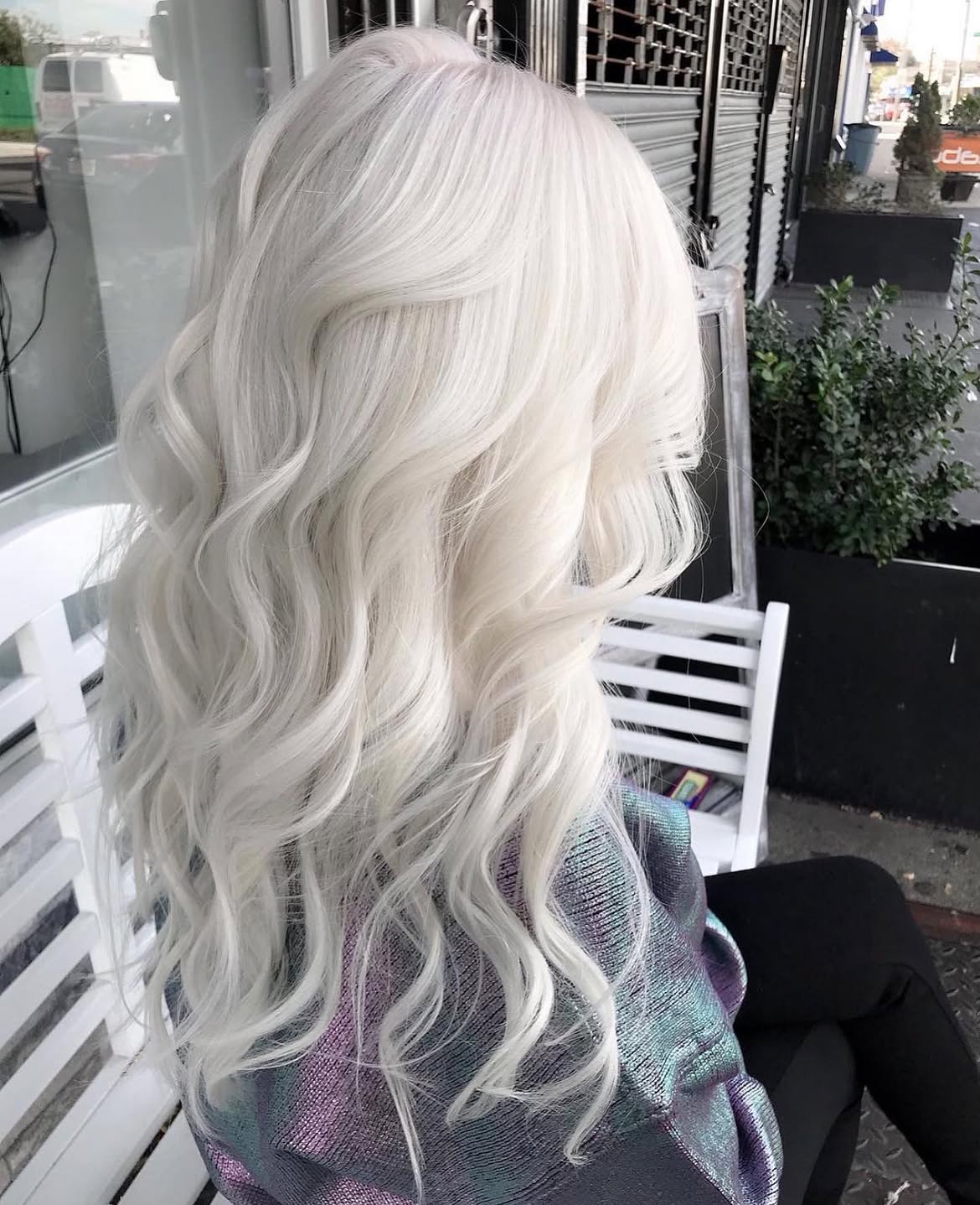 Extreme Platinum Blonde Waves With Face-Framing Layers