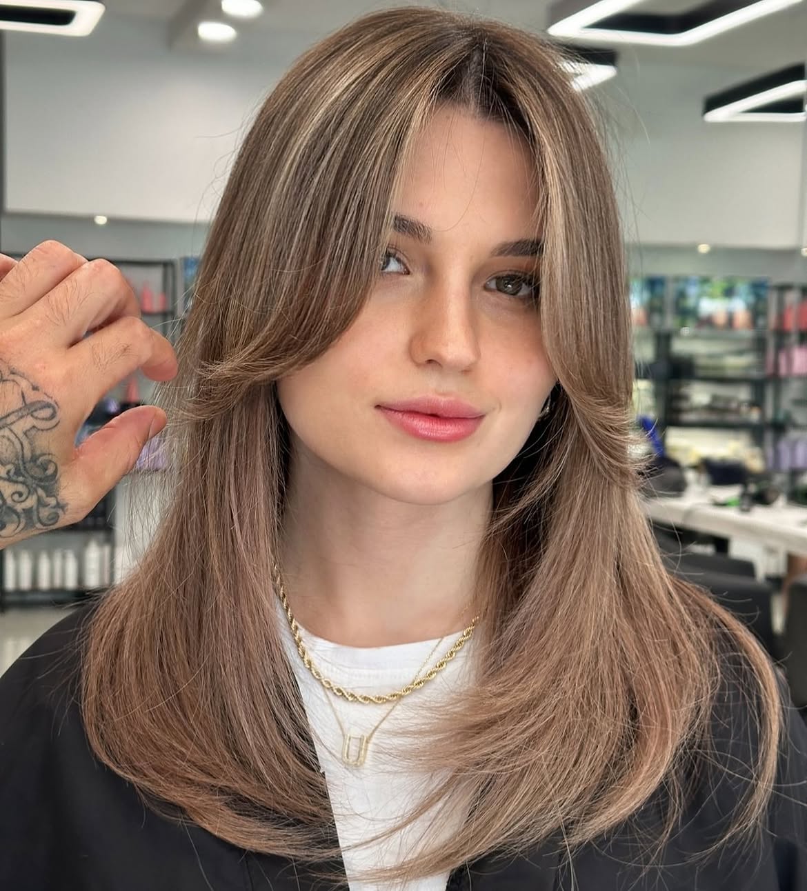 Face-Framing Curtain Bangs With Ashy Bronde Highlights