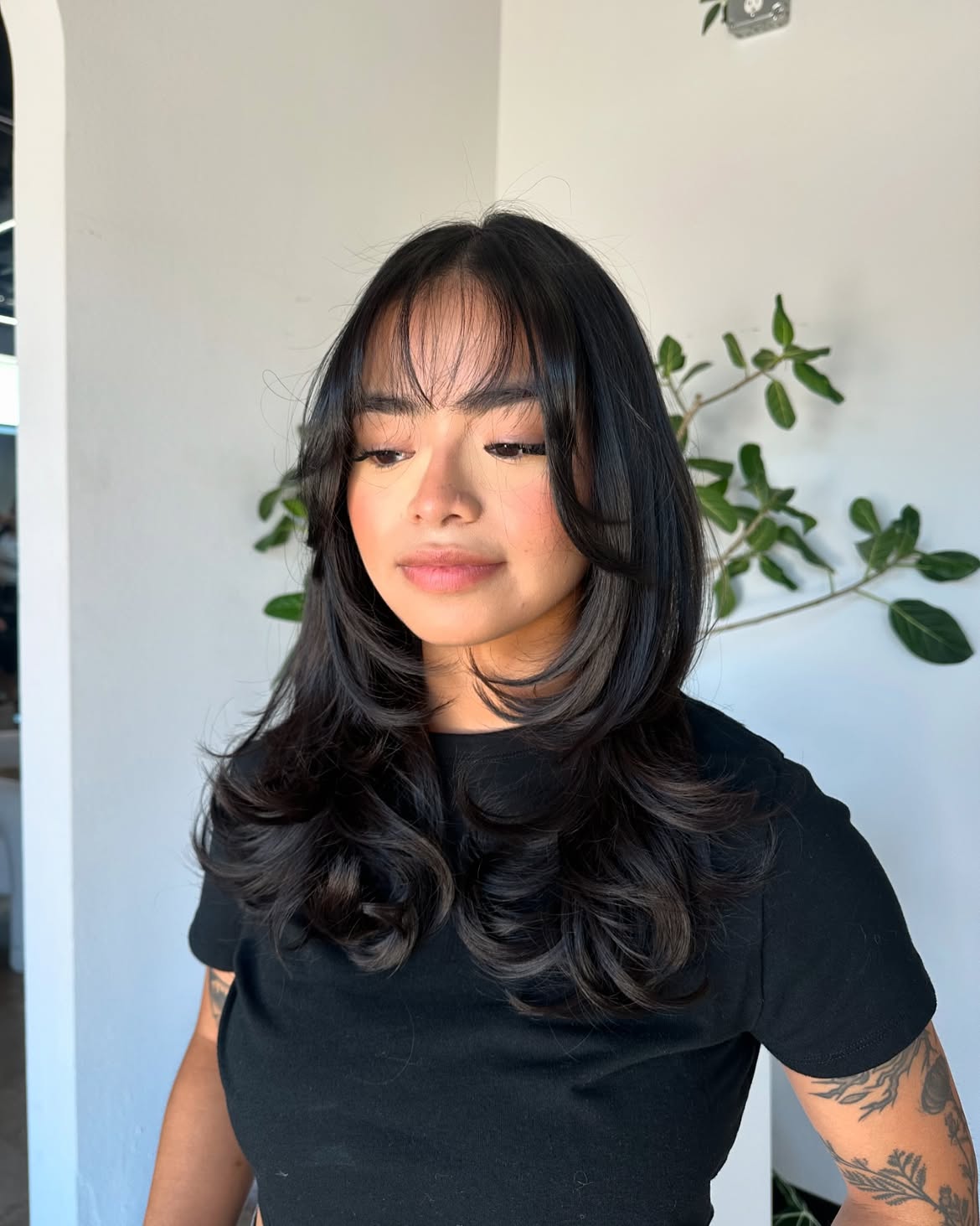 Feathered Layers With Wispy Face-Framing Bangs