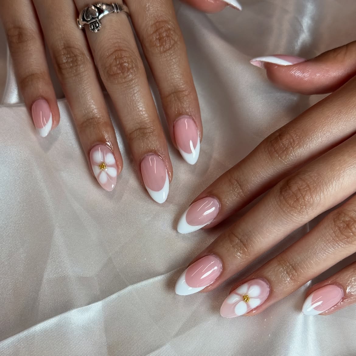 Glossy Almond French Tips With Delicate Floral Accents