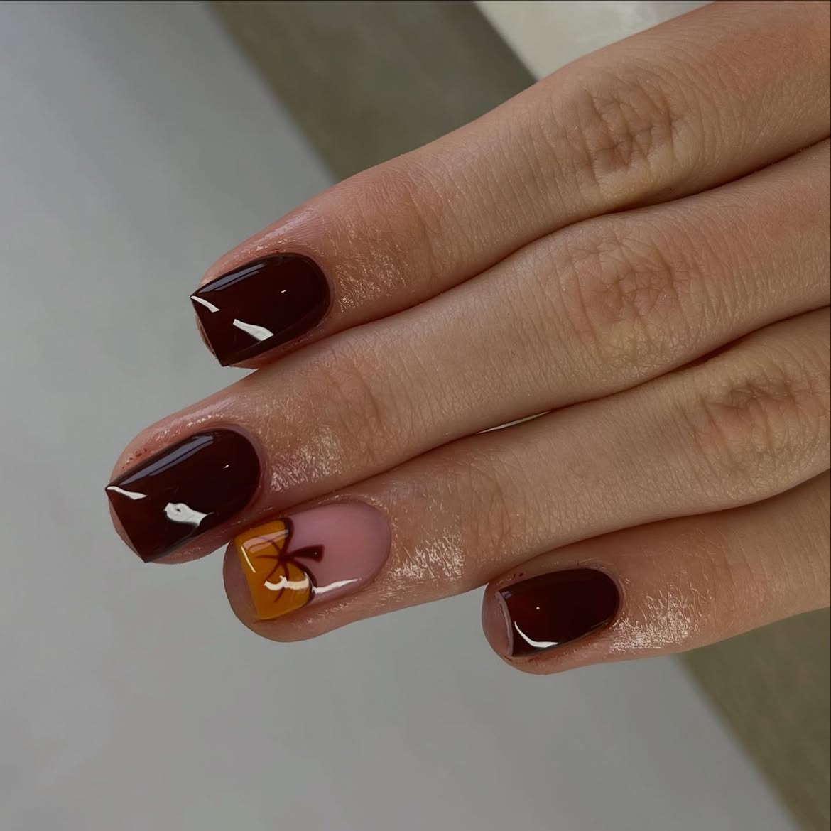 Glossy Chocolate Brown French Tips with Leaf Accent