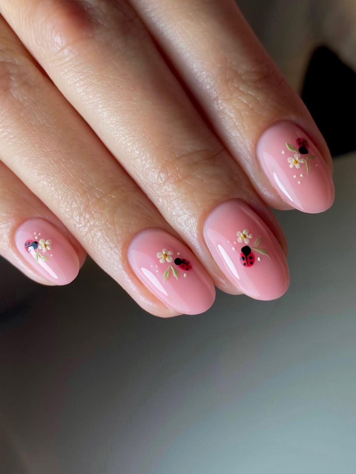 Glossy Pink Nails With Delicate Ladybug Art