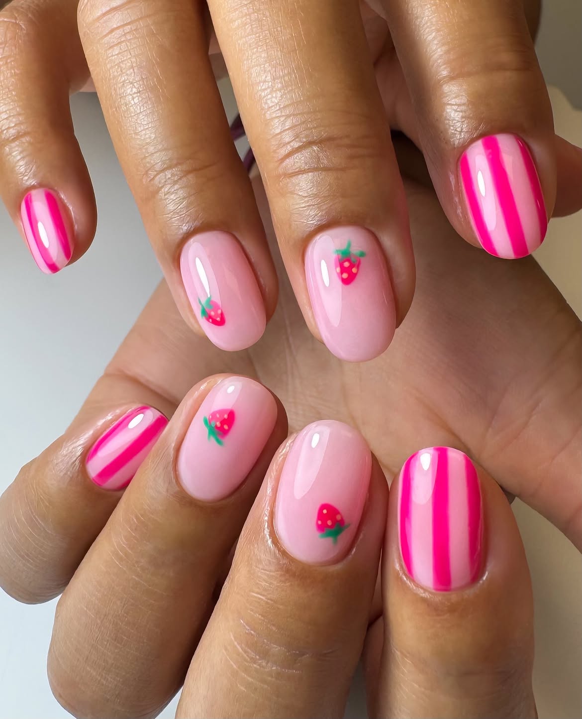 Glossy Pink Strawberry Striped Oval Nails