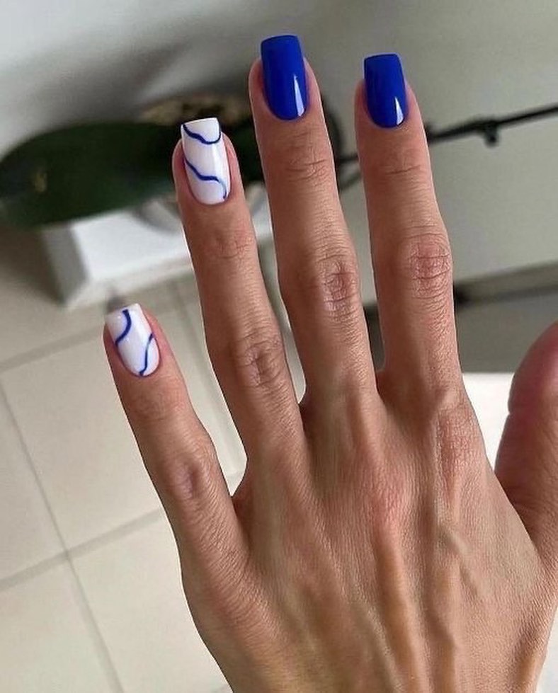 Glossy Royal Blue Swirl Accent Nails