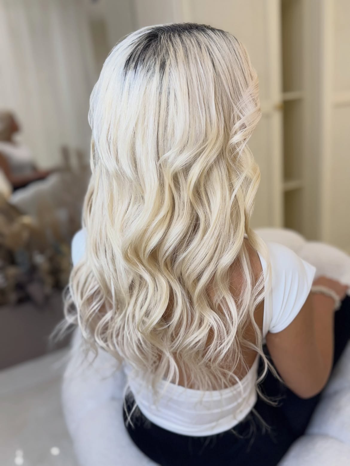 Icy Platinum Blonde Waves With Dark Shadow Root