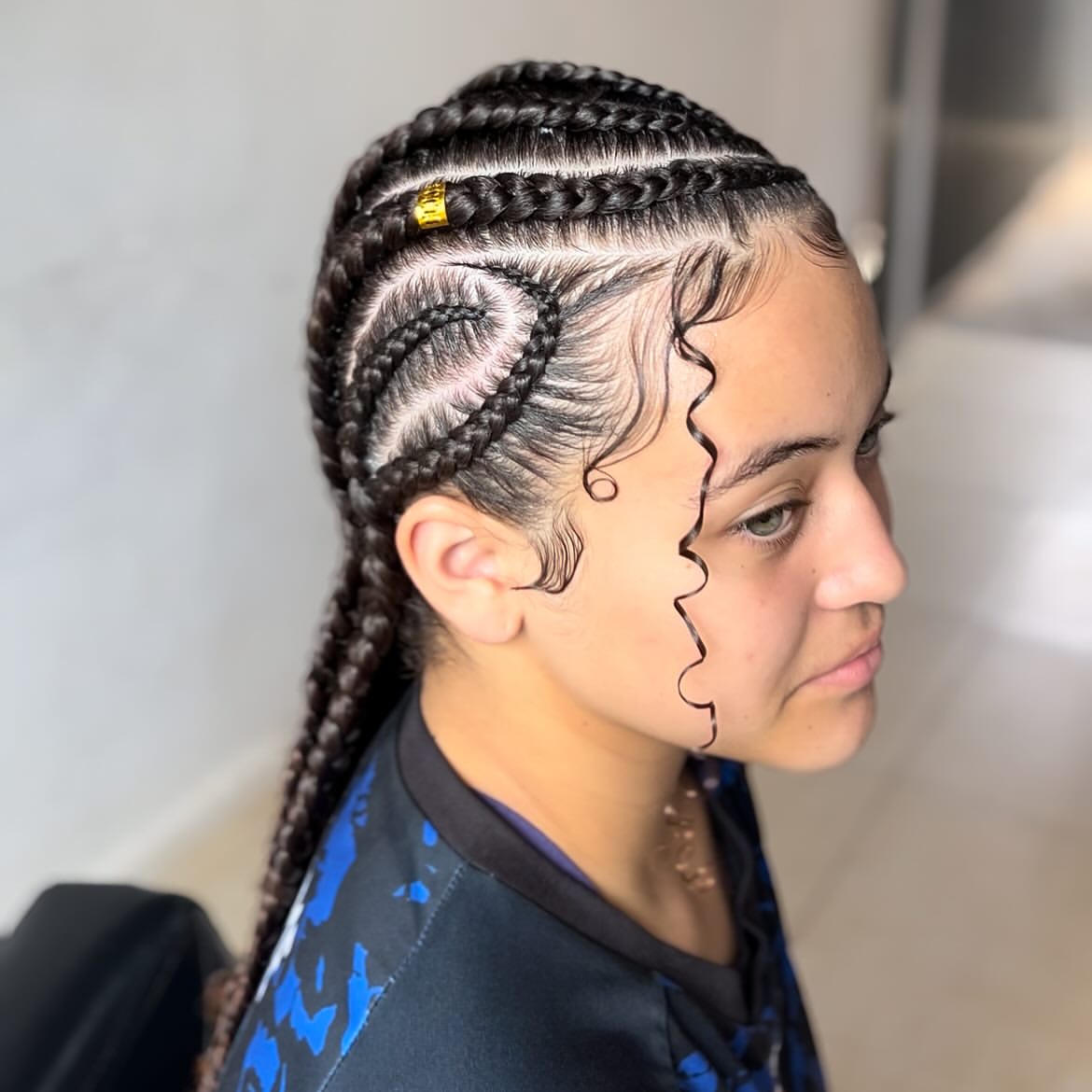 Intricate Cornrow Braids With Laid Edges And Gold Accents