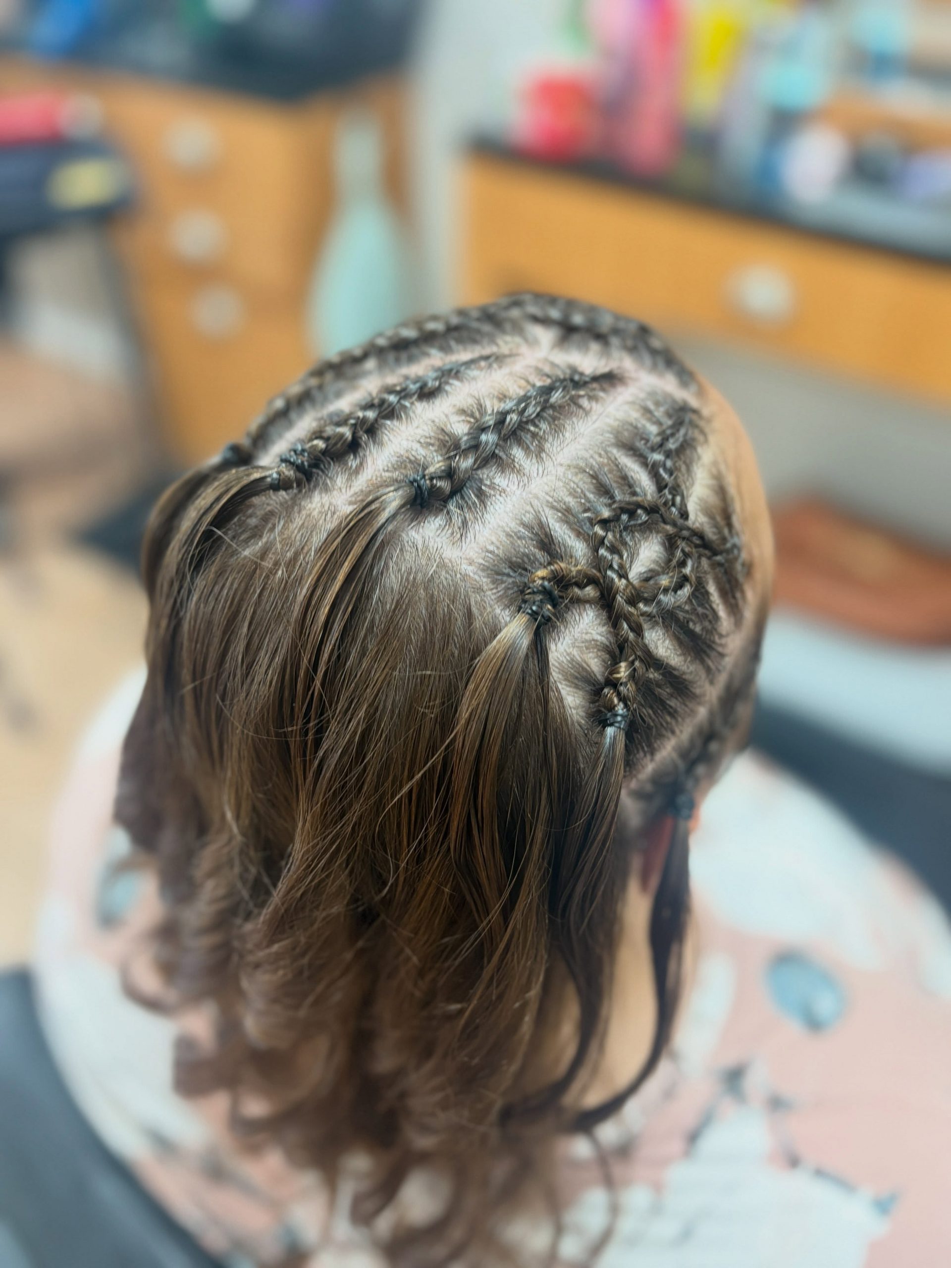 Intricate Geometric Cornrow Braids With Loose Waves