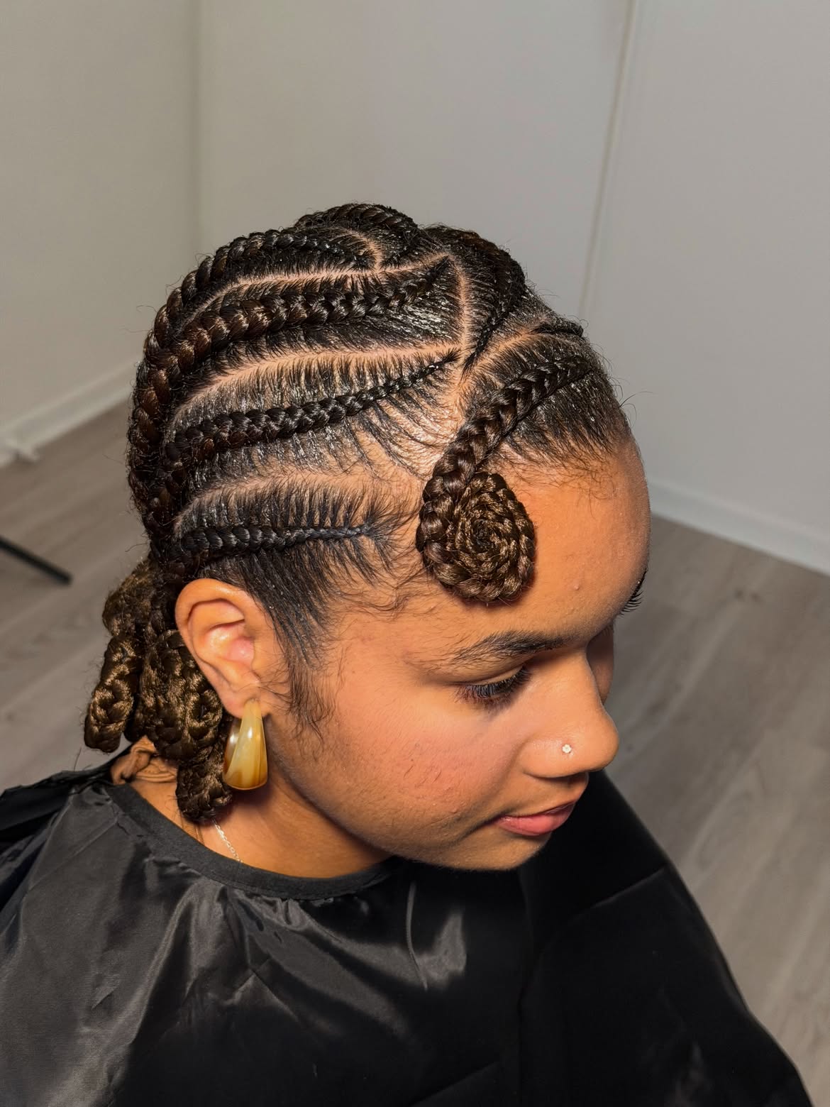 Intricate Geometric Cornrows With A Spiral Front Accent