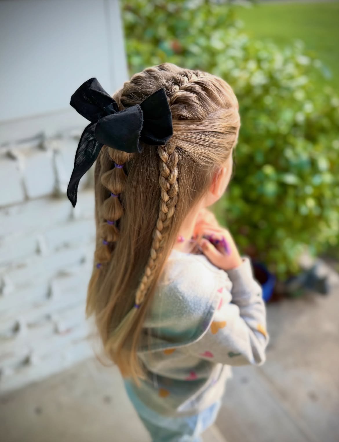 Intricate Half Up Braided Hairstyle With Bow