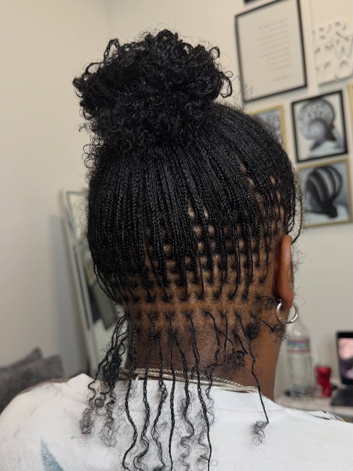 Intricate Micro Braids With Textured High Bun