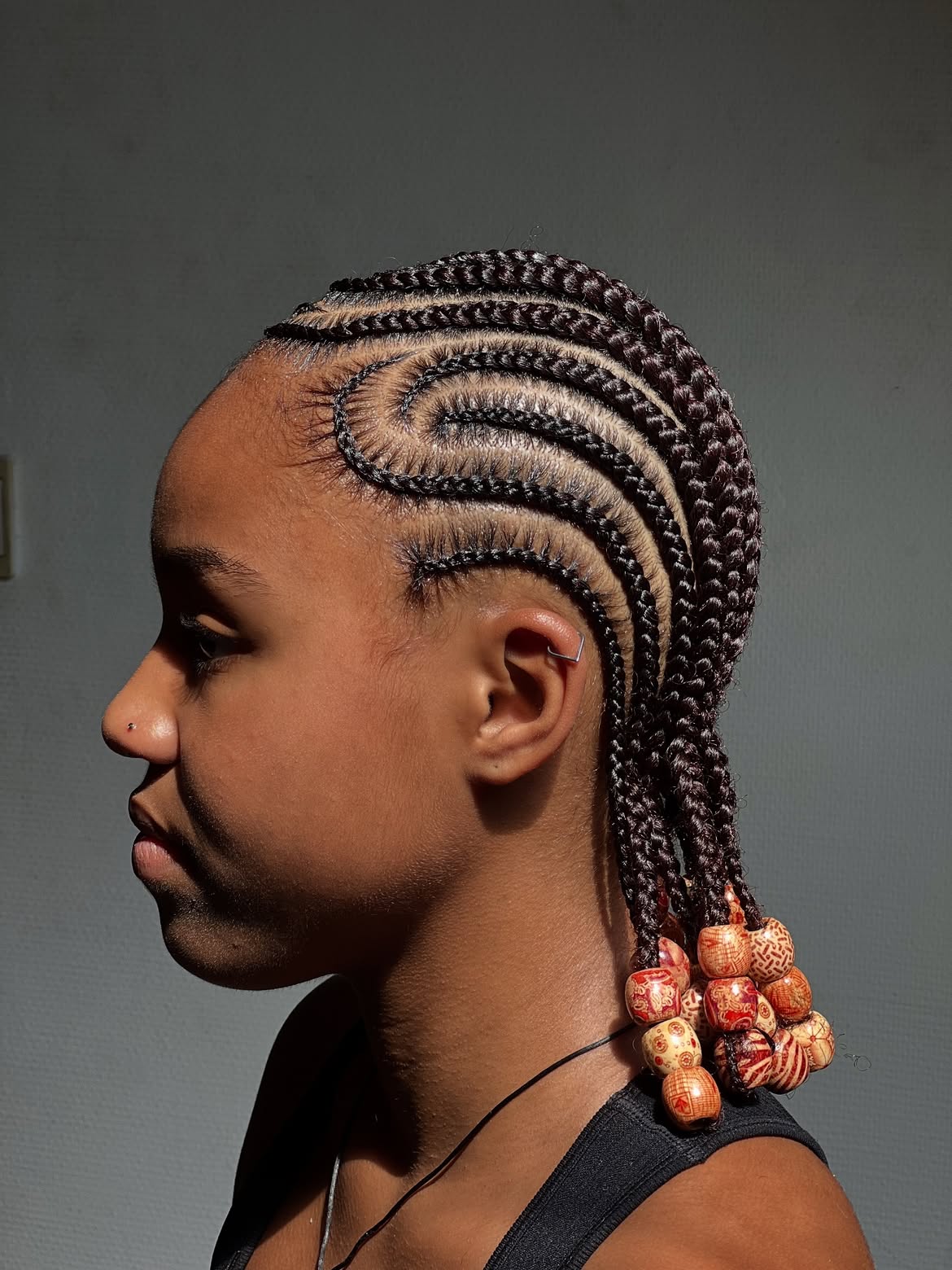 Intricate Swirl Cornrow Braids With Wooden Beads