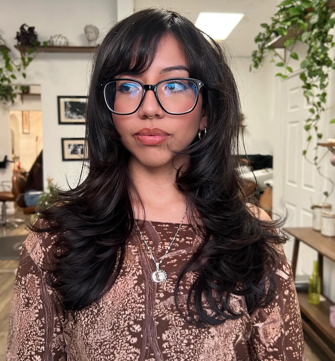 Layered Dark Hair With Voluminous Side Swept Bangs