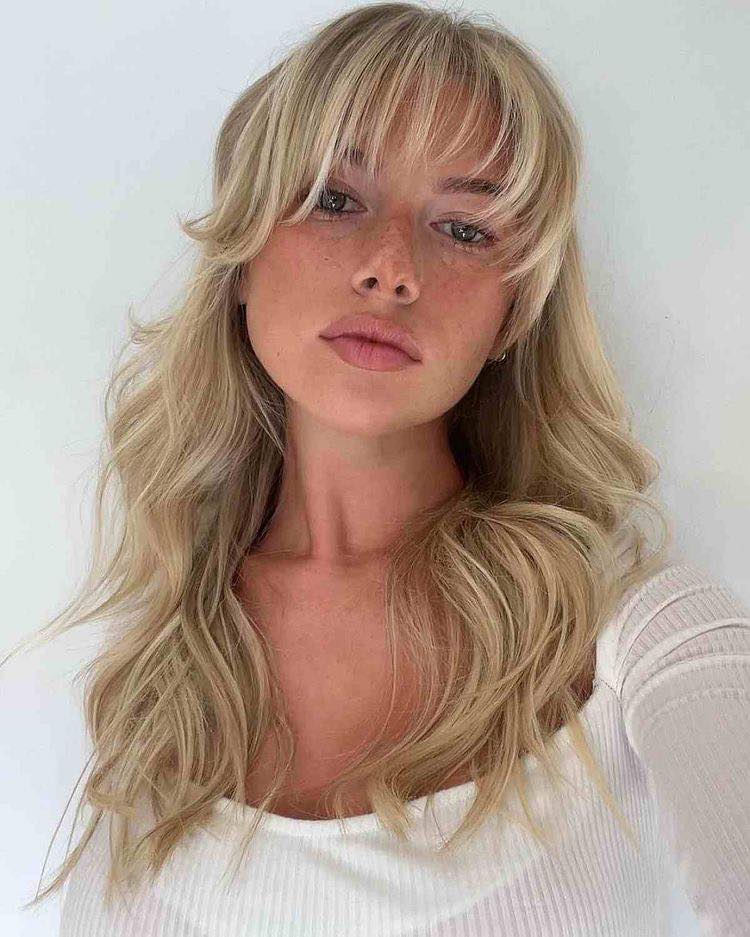 Light Blonde Wispy Bangs With Textured Waves