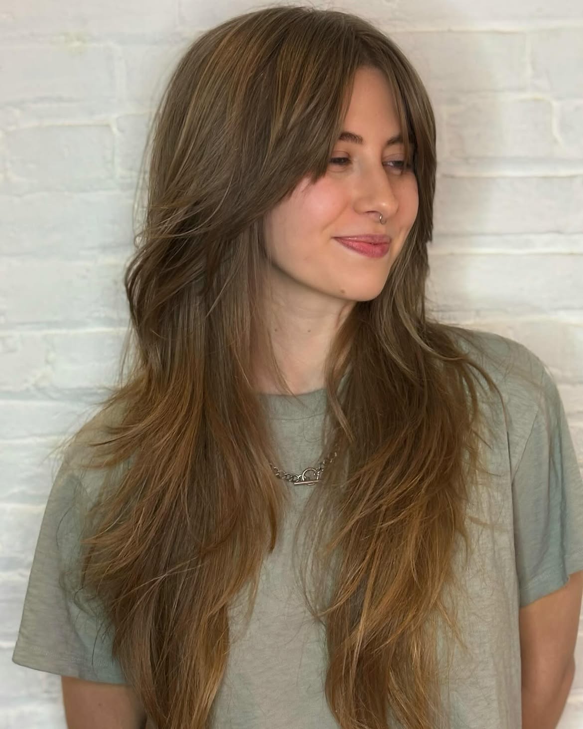 Long Feathered Layers With Soft Curtain Bangs