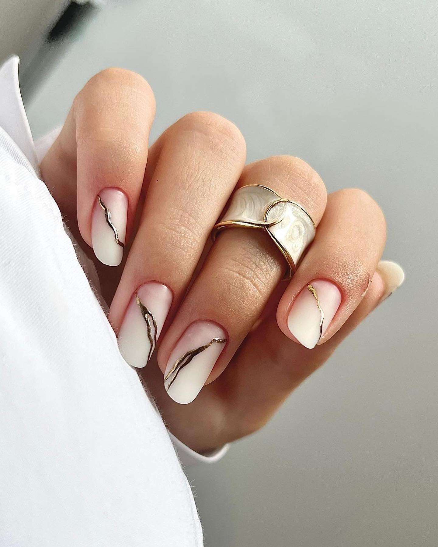 Matte Ombre Nails with Gold Marble Accents