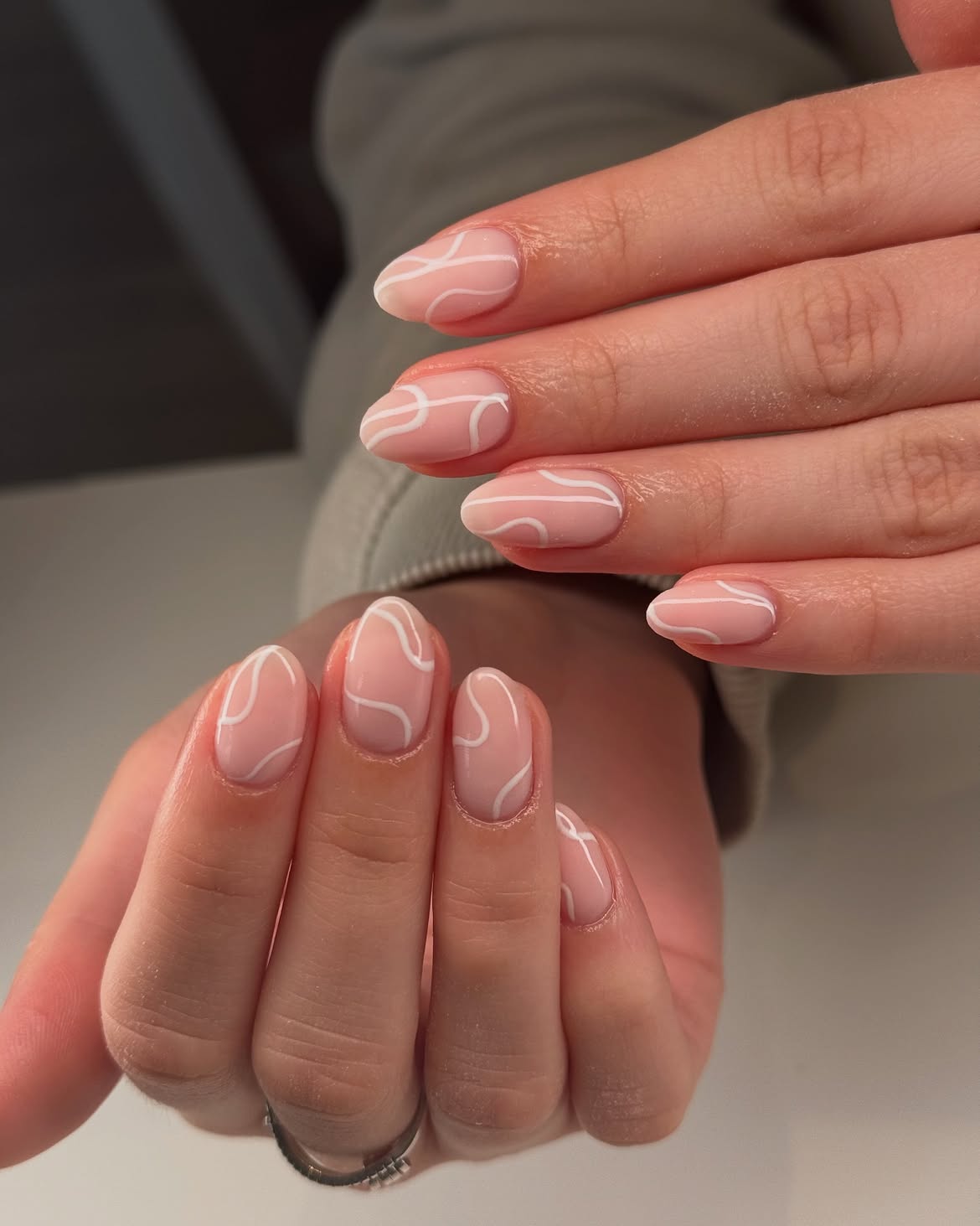 Milky Pink Abstract Swirl Almond Nails