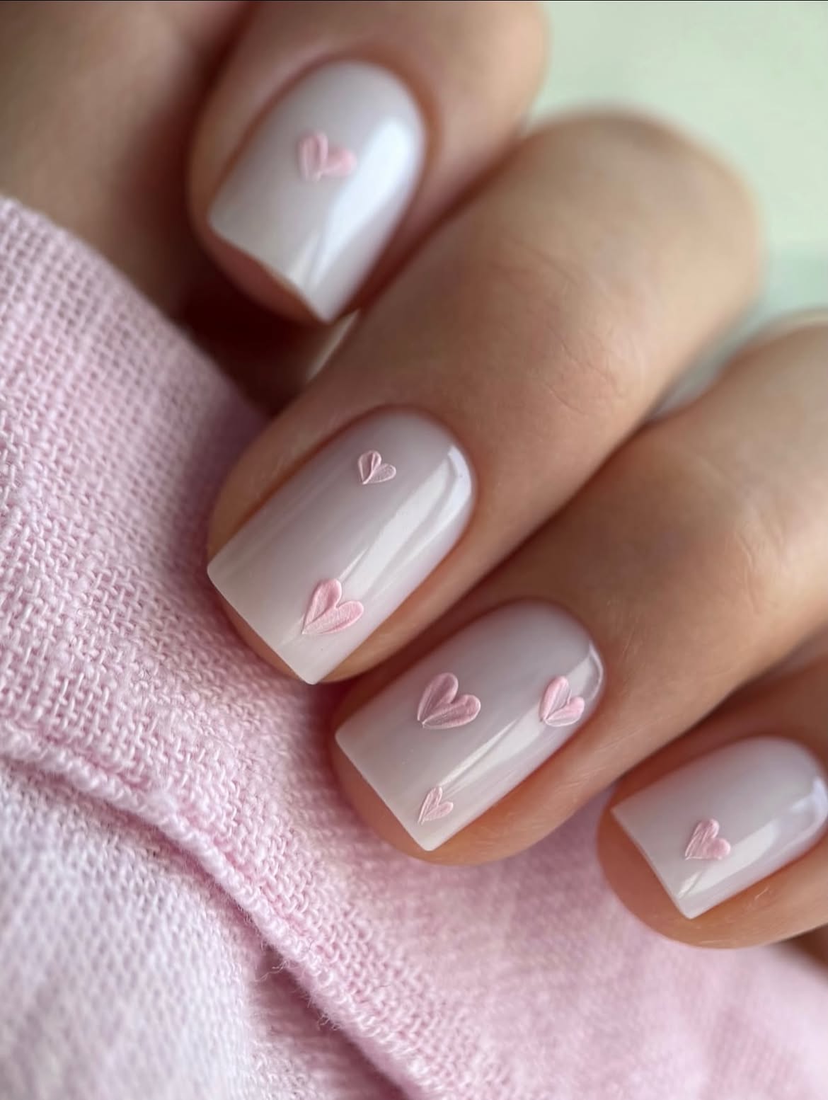 Milky White Nails With Delicate Pastel Pink Hearts