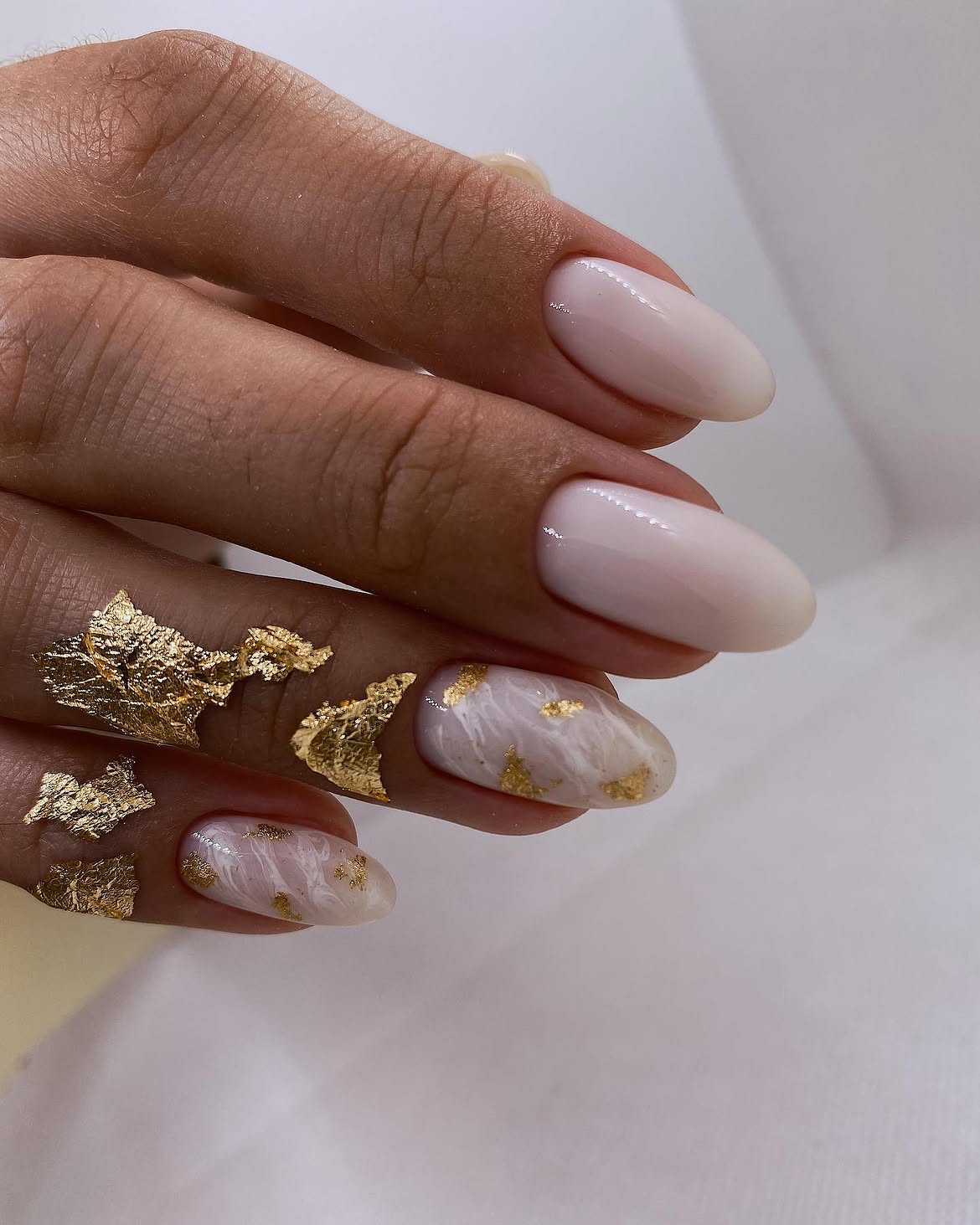 Milky White Oval Nails With Gold Leaf Accent